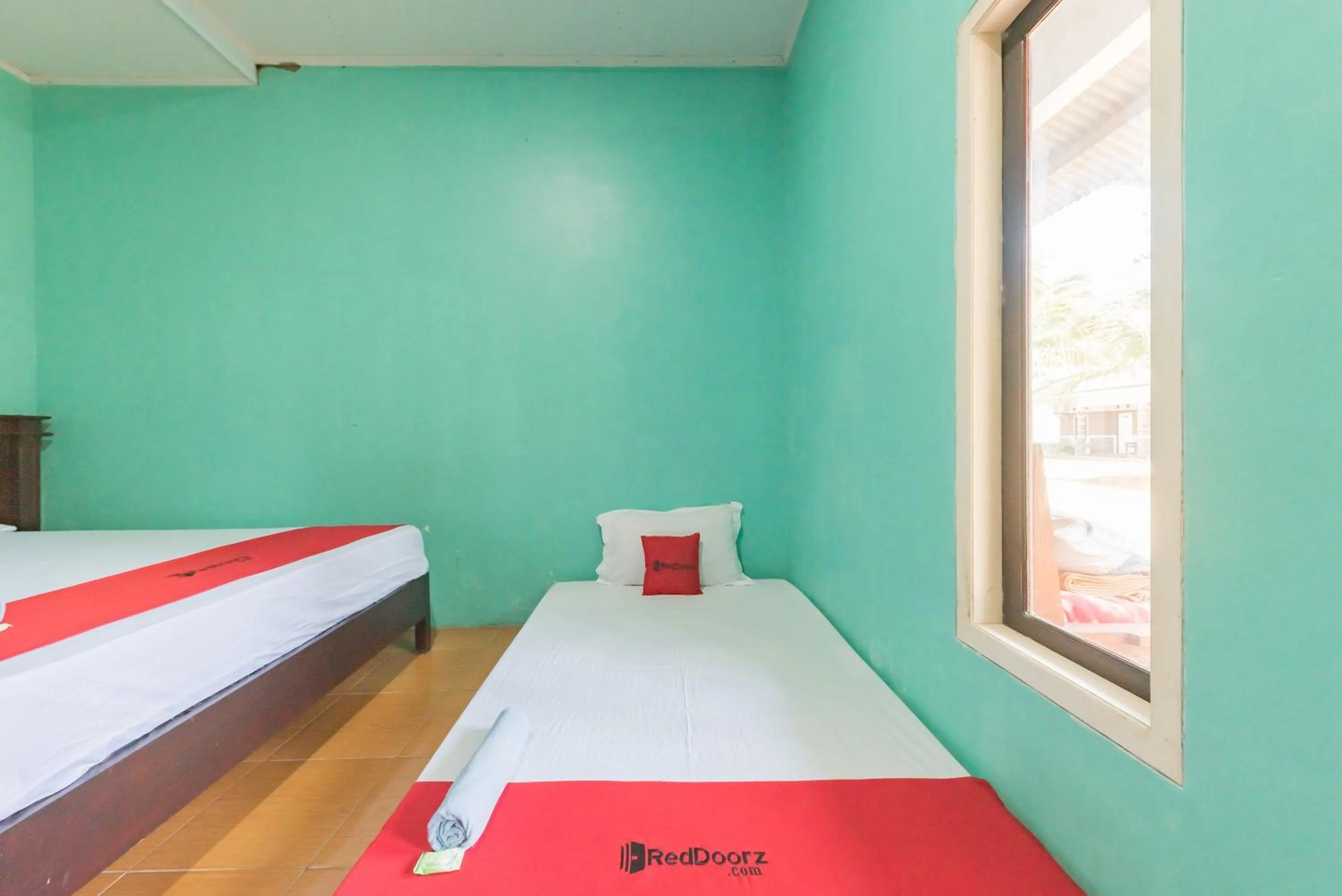 Bed in RedDoorz near Pantai Ujung Genteng