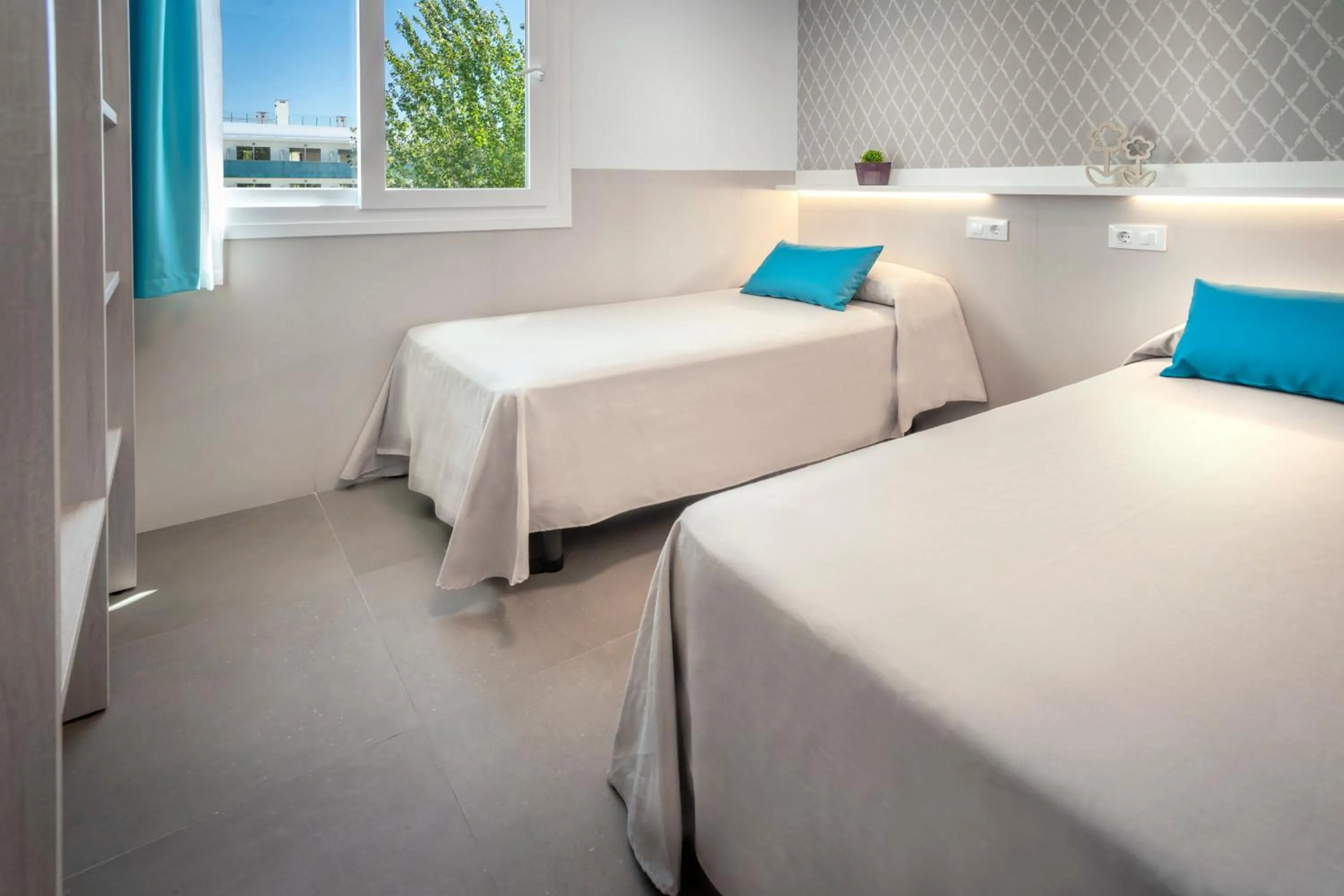 Bedroom, Bed in Rentalmar Salou Playa Family Suites & Pool