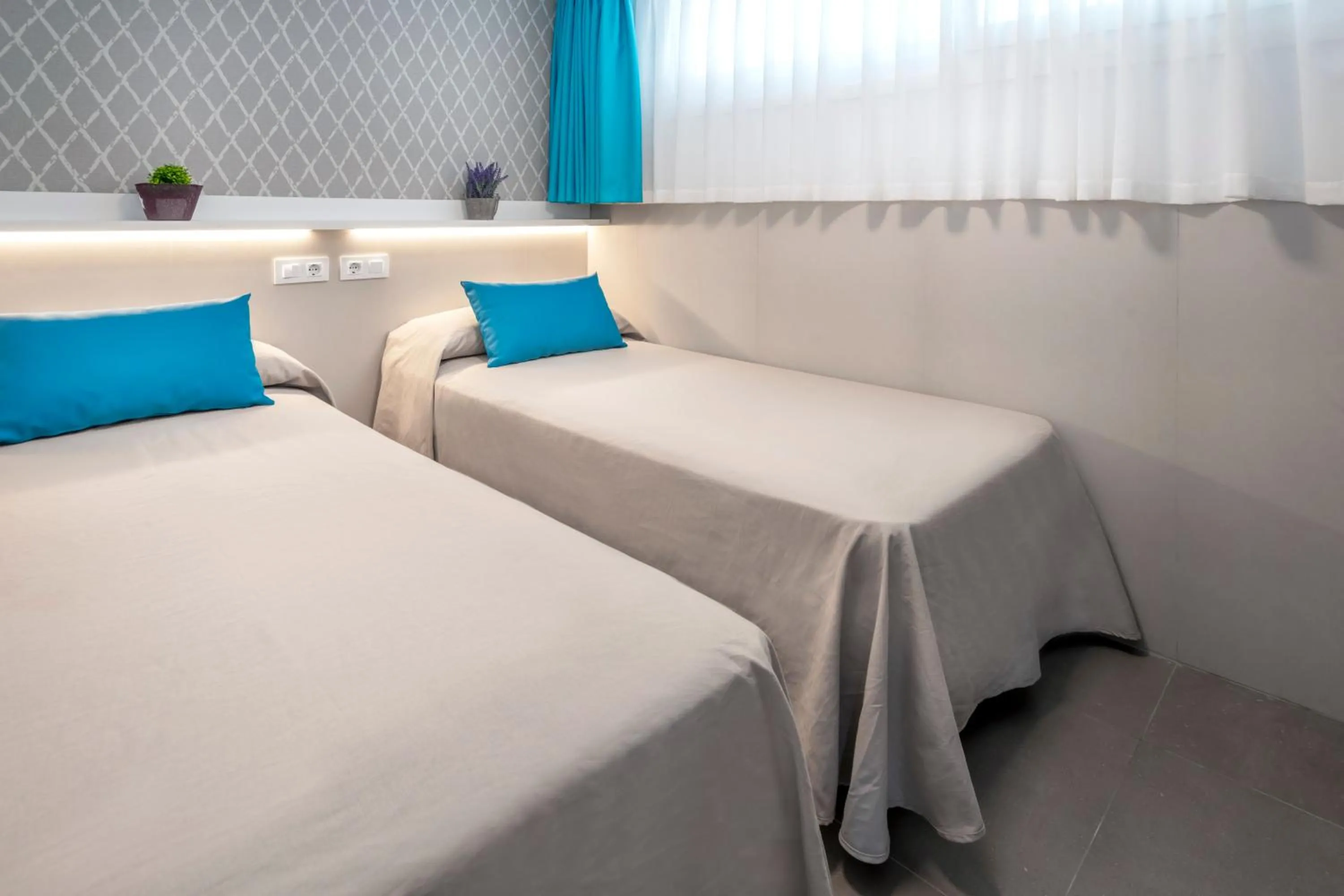 Bedroom, Bed in Rentalmar Salou Playa Family Suites & Pool