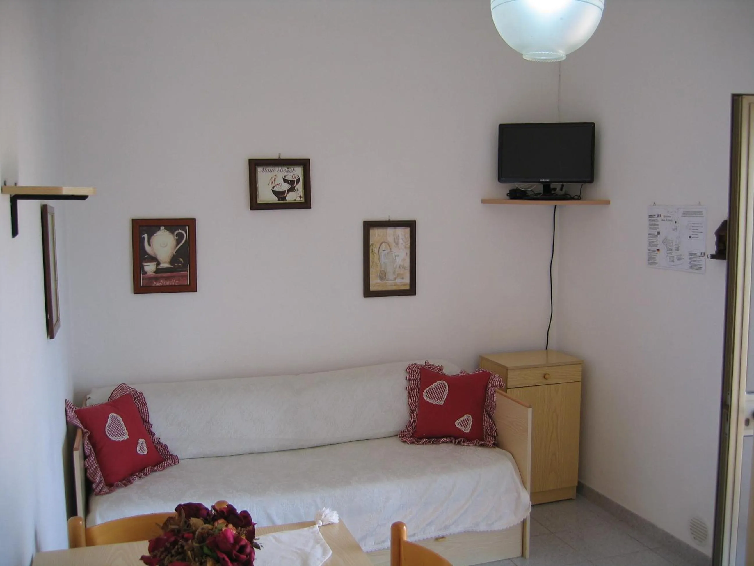 Seating area, Bed in Baia Azzurra