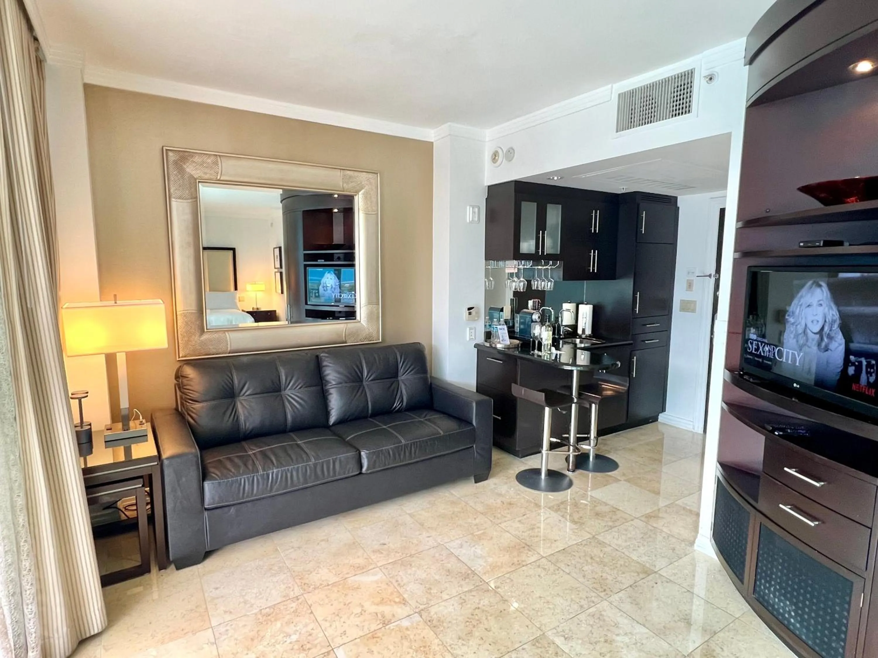 TV and multimedia in Boutique Suites 3 min walk to beach