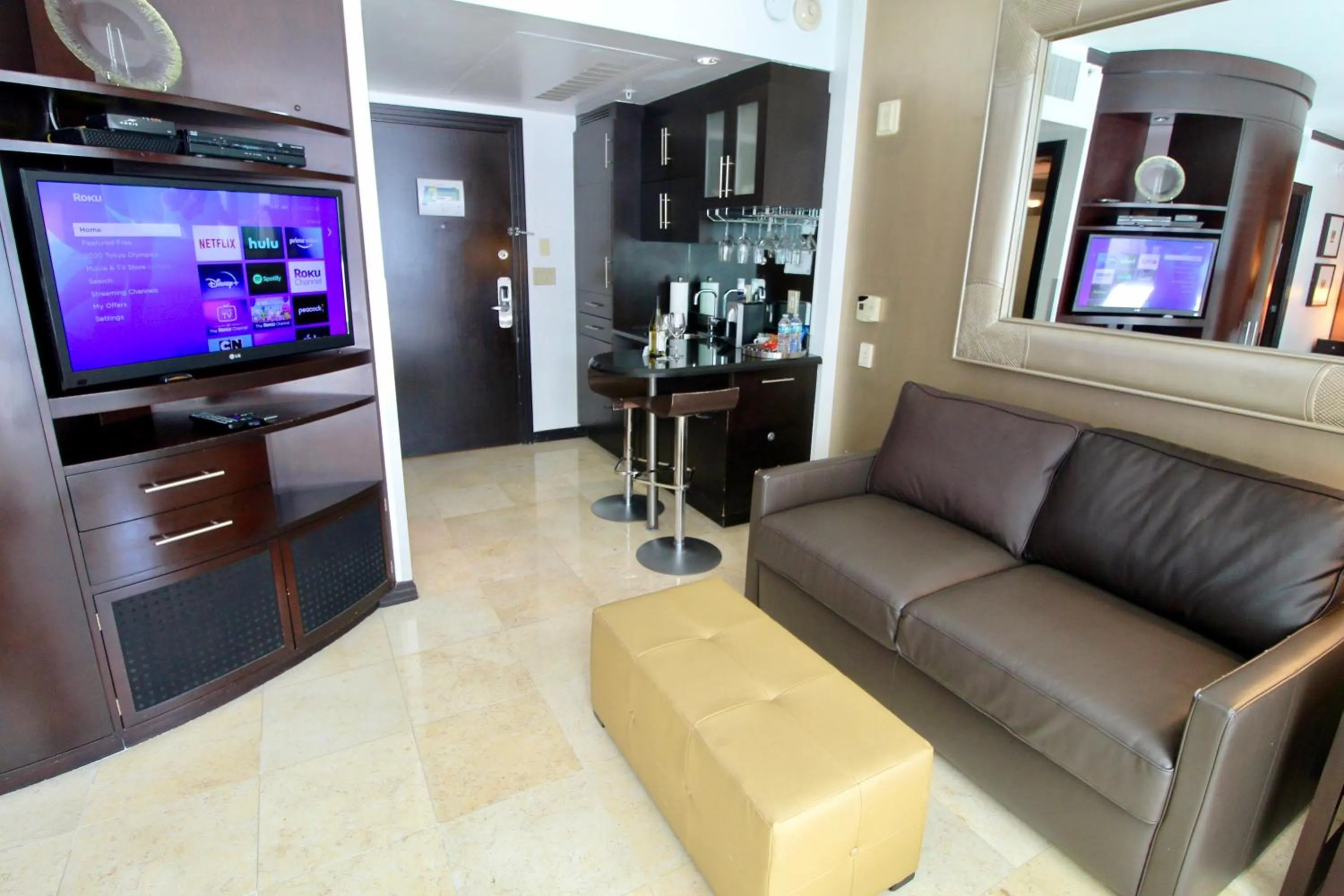 TV and multimedia in Boutique Suites 3 min walk to beach