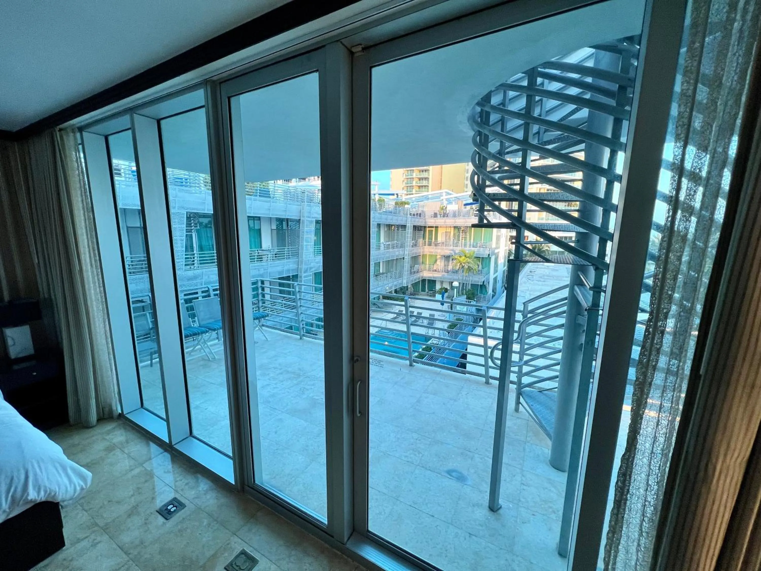 Balcony/Terrace, Bed in Boutique Suites 3 min walk to beach