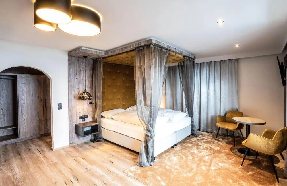 Photo of the whole room, Bed in Mooshaus Winterresort