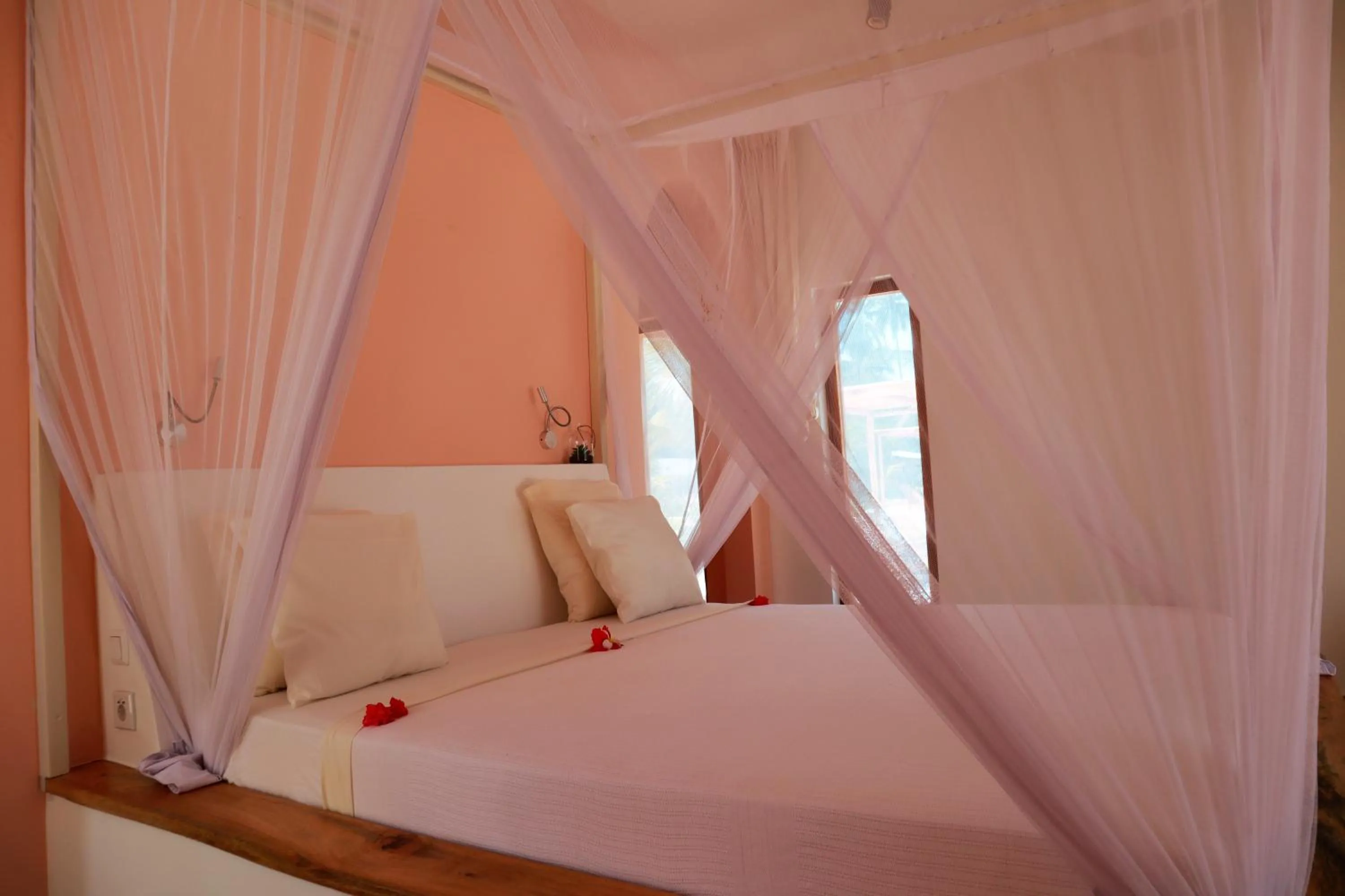 Bed in Kijani Beach Villas