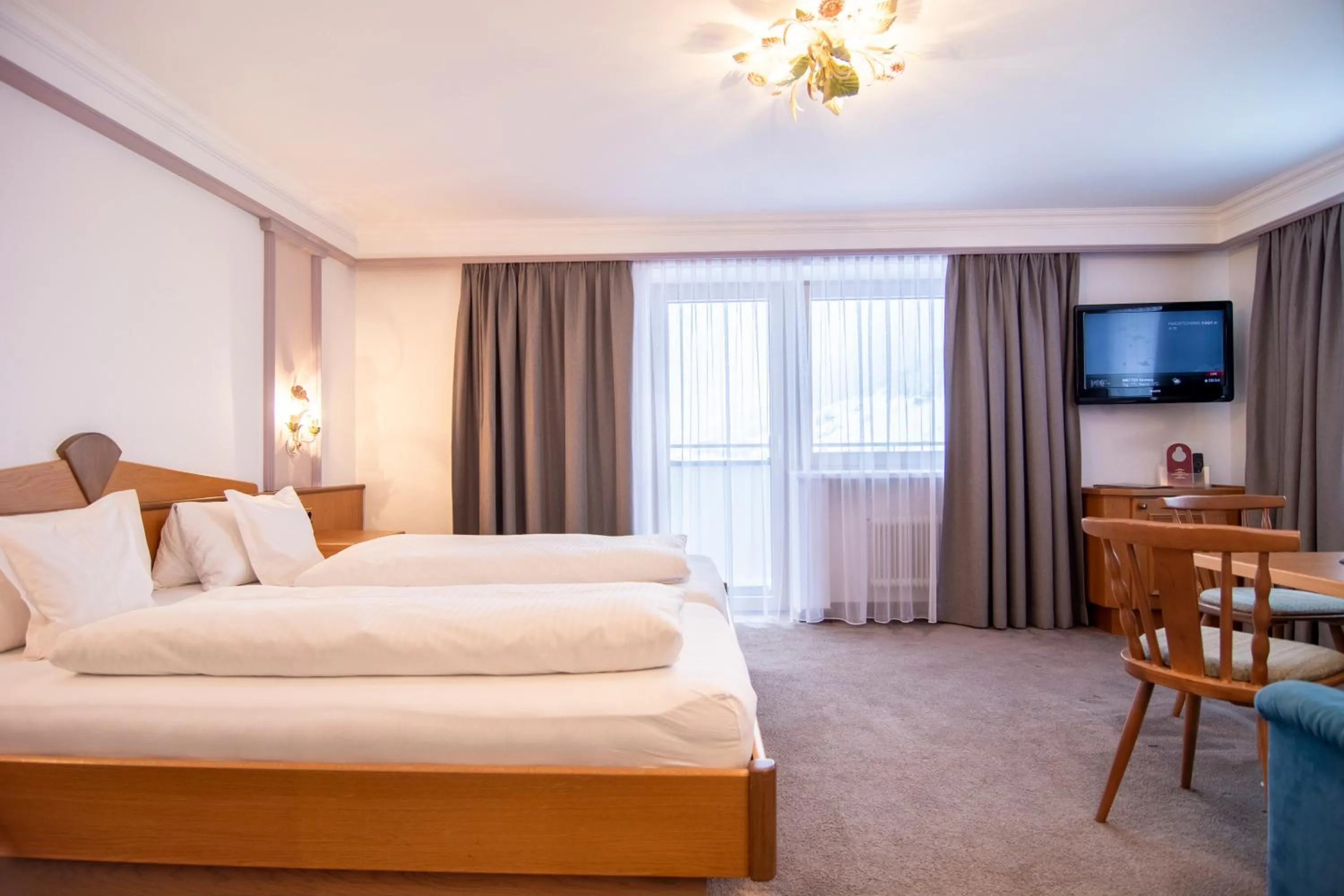 Bed in Hotel Garni Helvetia