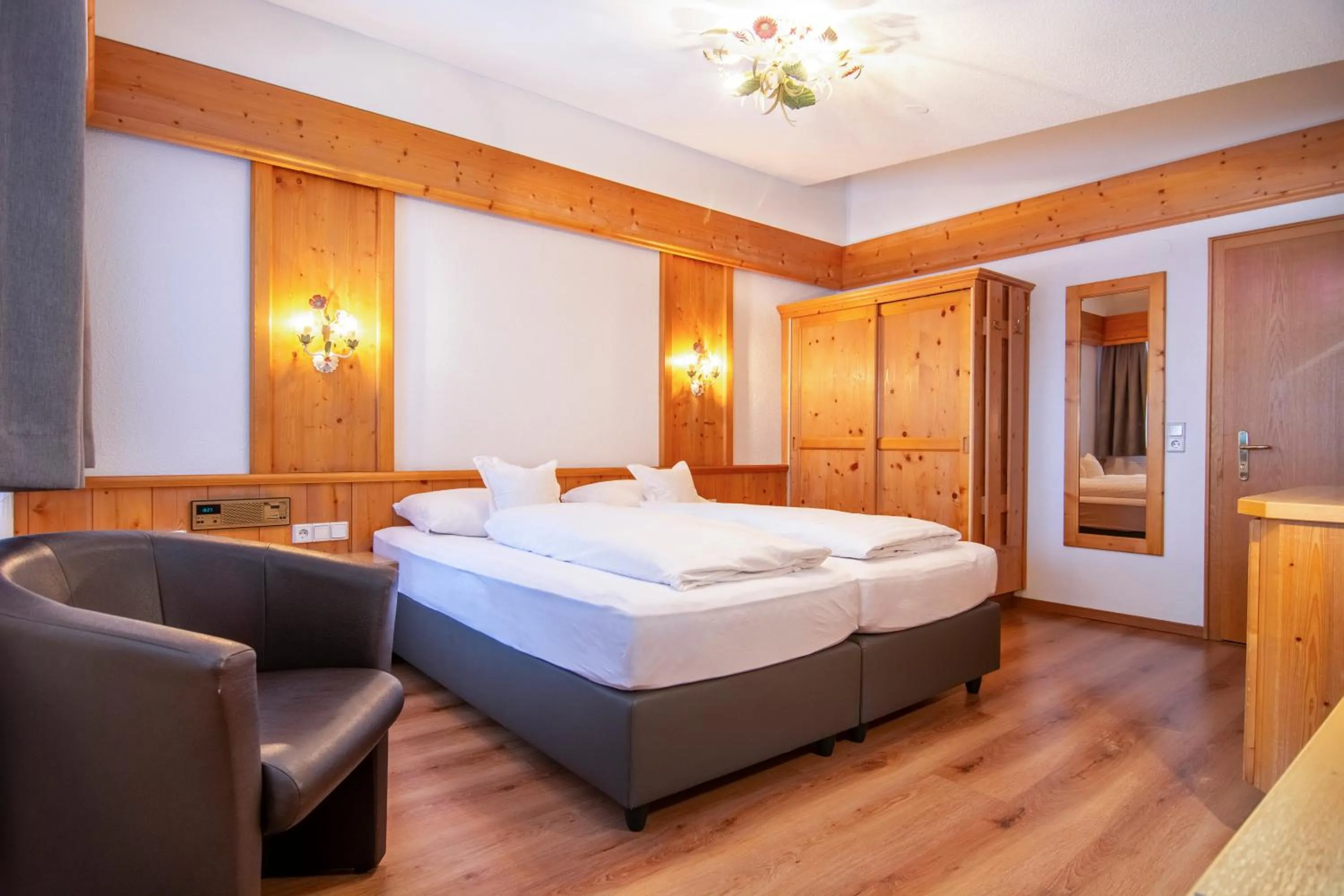 Bed in Hotel Garni Helvetia
