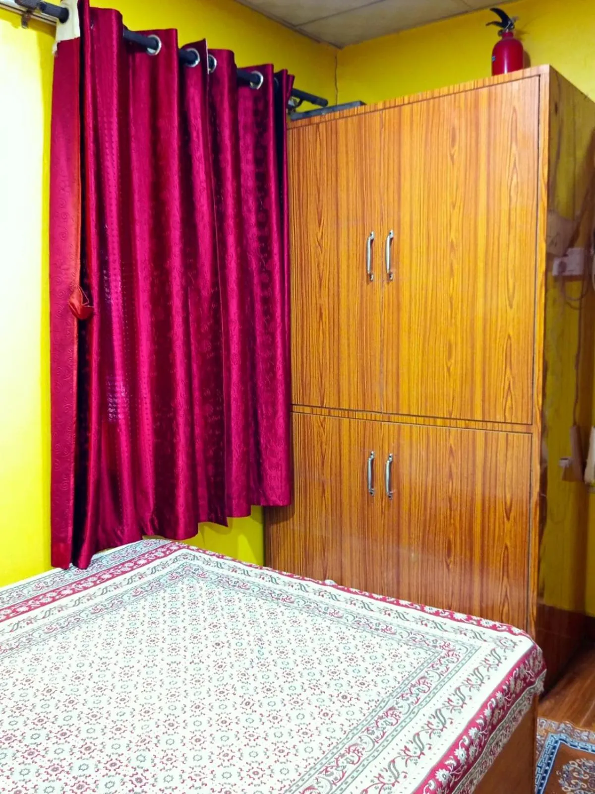 Bed in Deepjyoti Inn