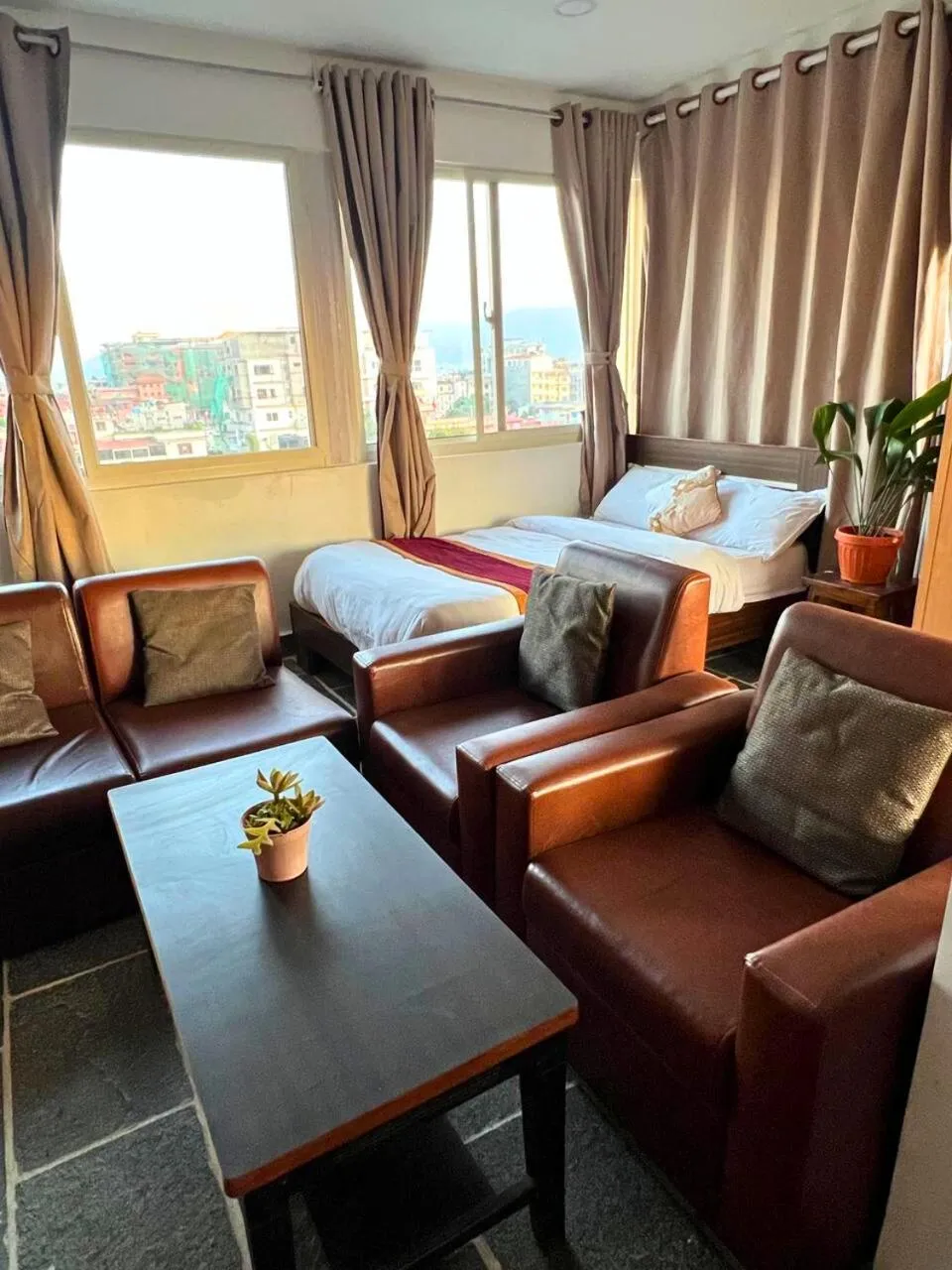 Living room, Bed in Deepjyoti Inn