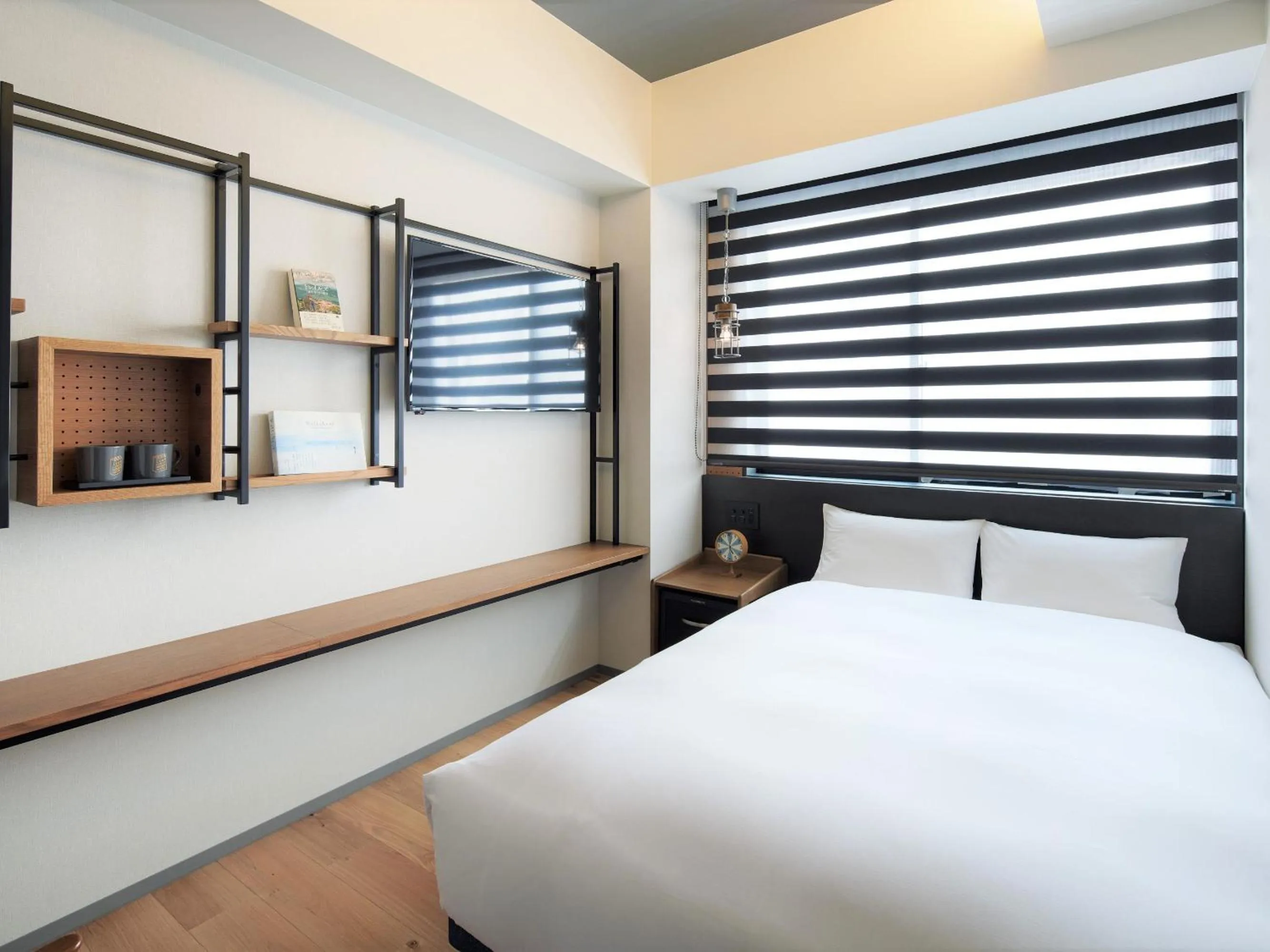 Bed in LAMP LIGHT BOOKS HOTEL fukuoka