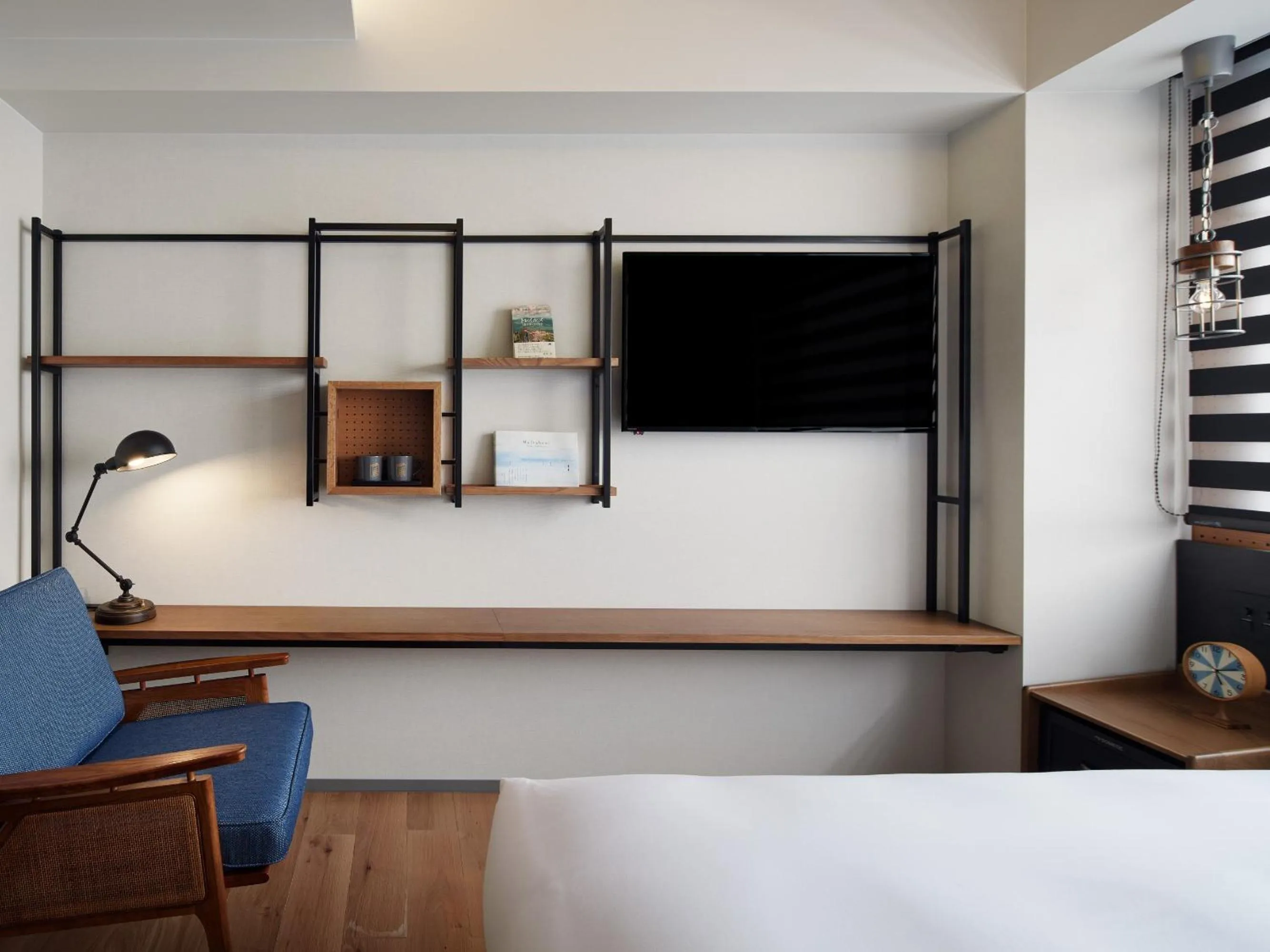 Living room, Bed in LAMP LIGHT BOOKS HOTEL fukuoka