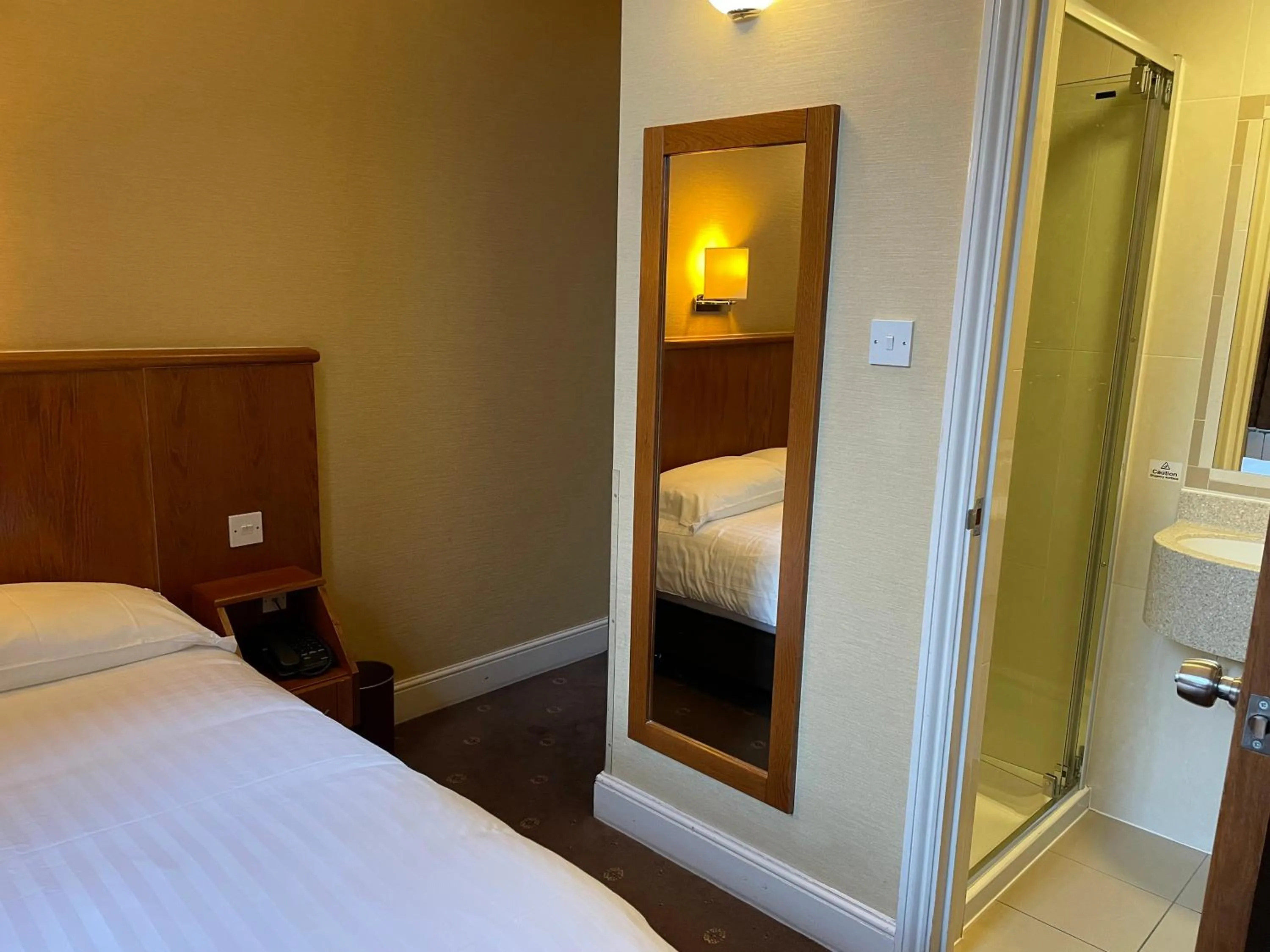 Bed in Orchard Hotel