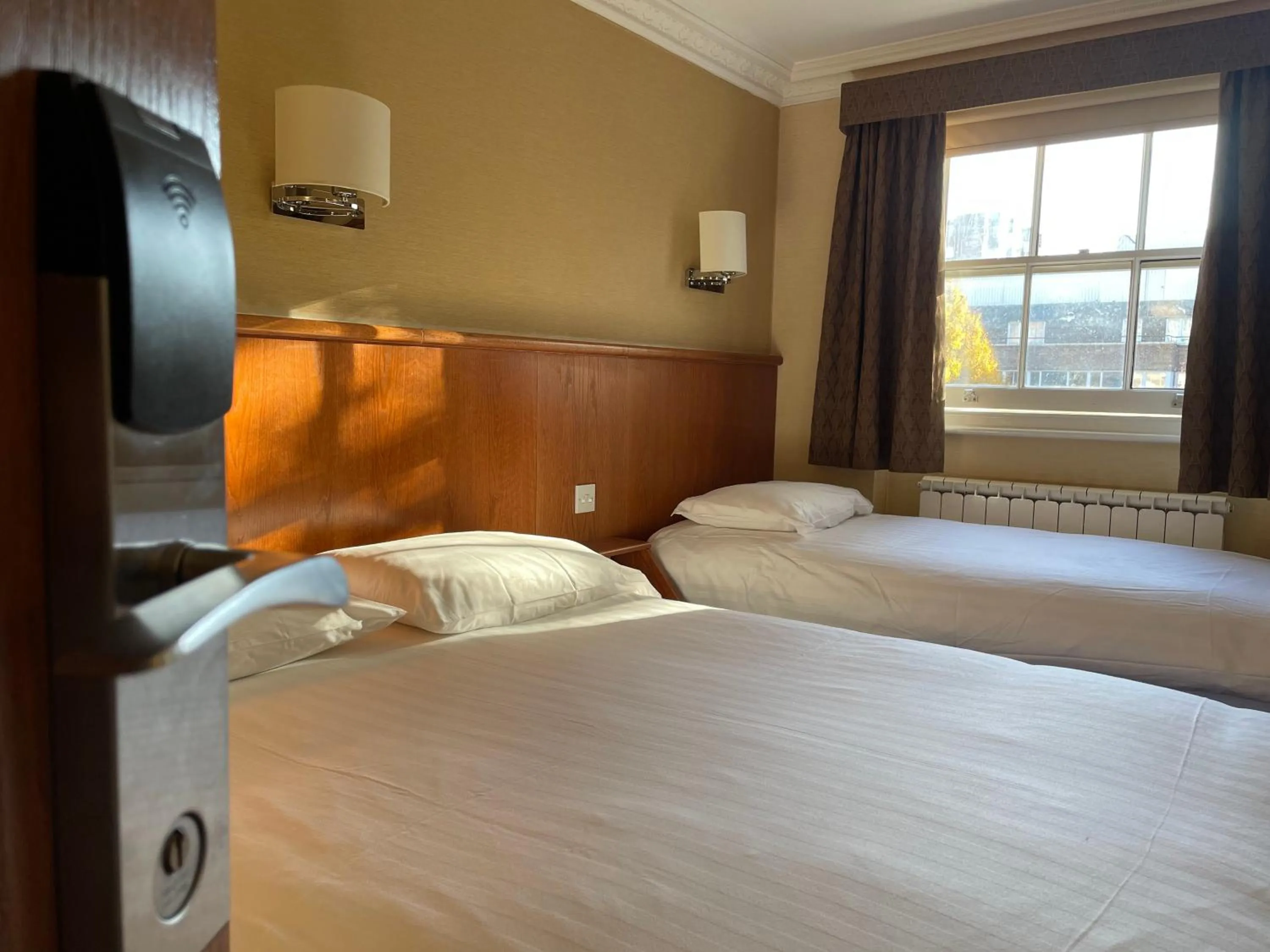 Bed in Orchard Hotel