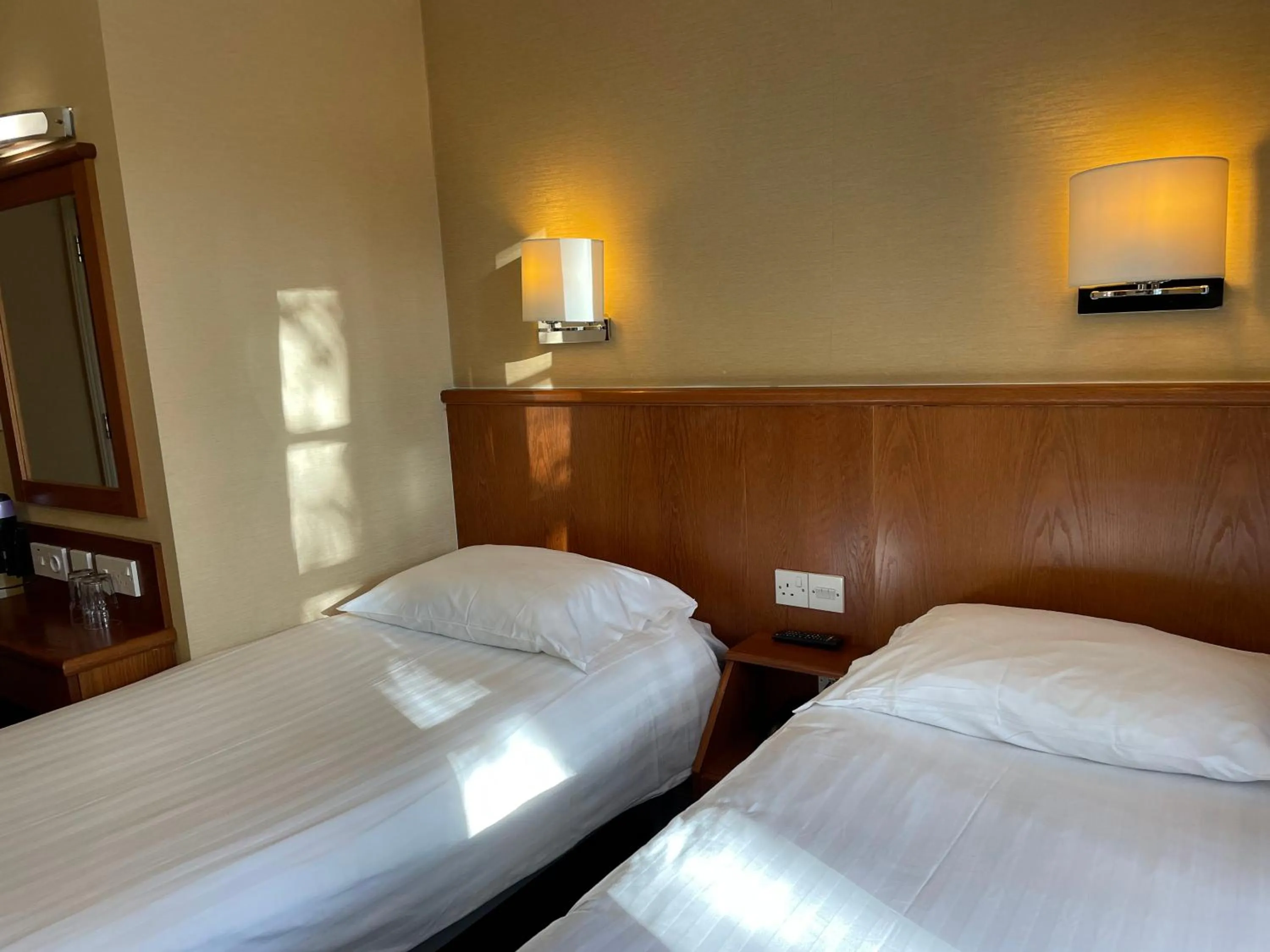 Bed in Orchard Hotel