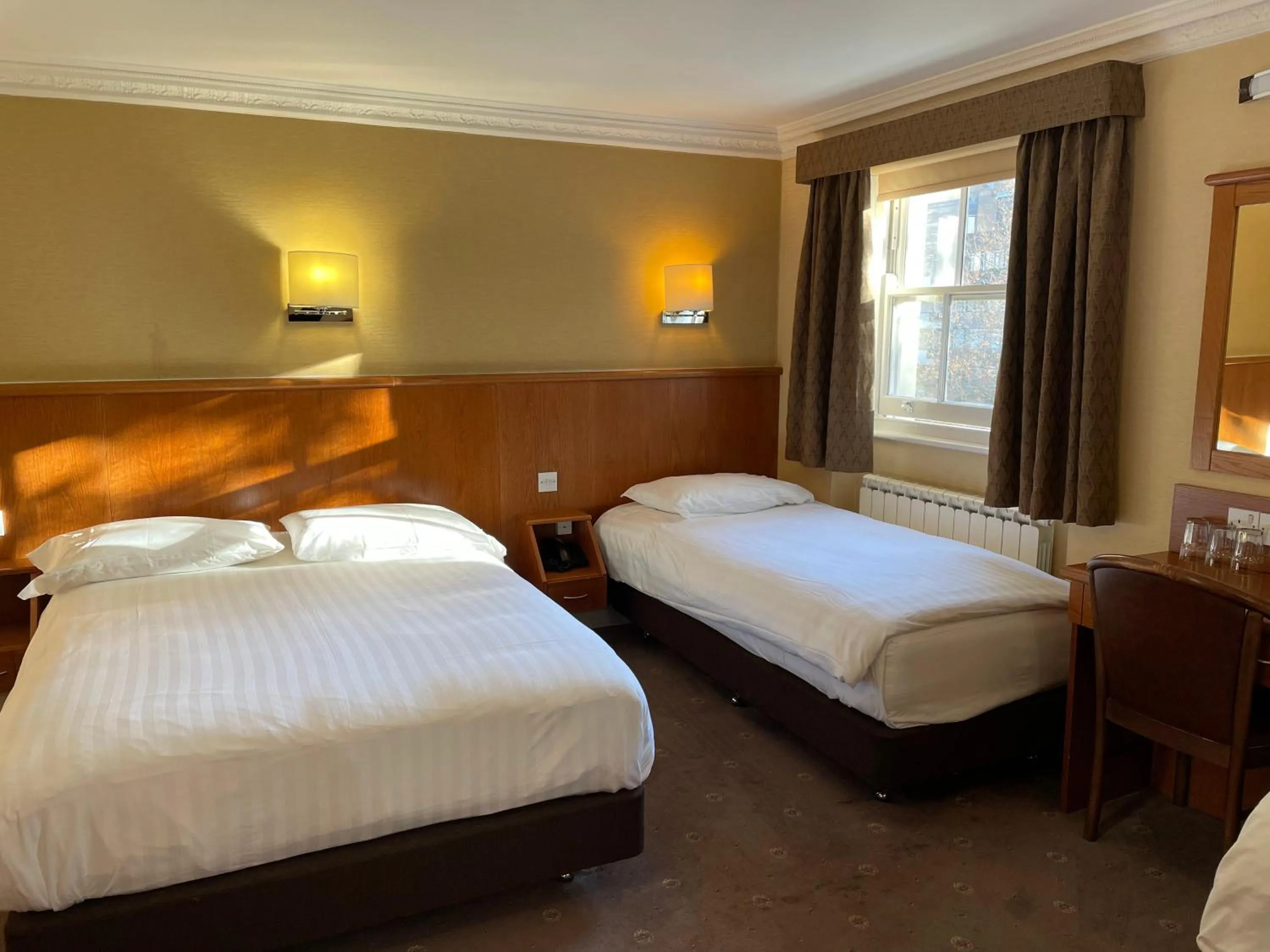 Bed in Orchard Hotel