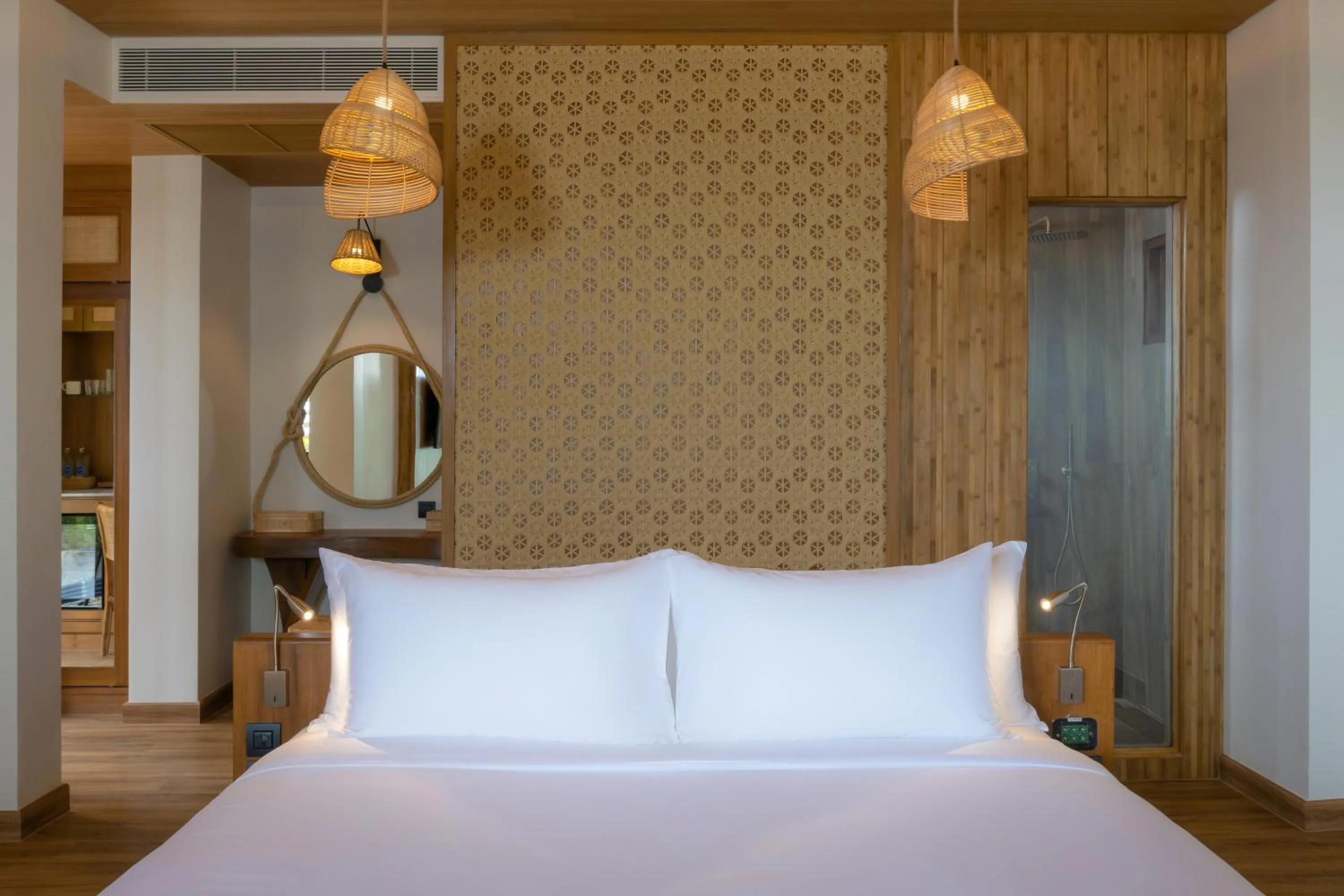 Bed in SINAE Phuket Luxury Hotel