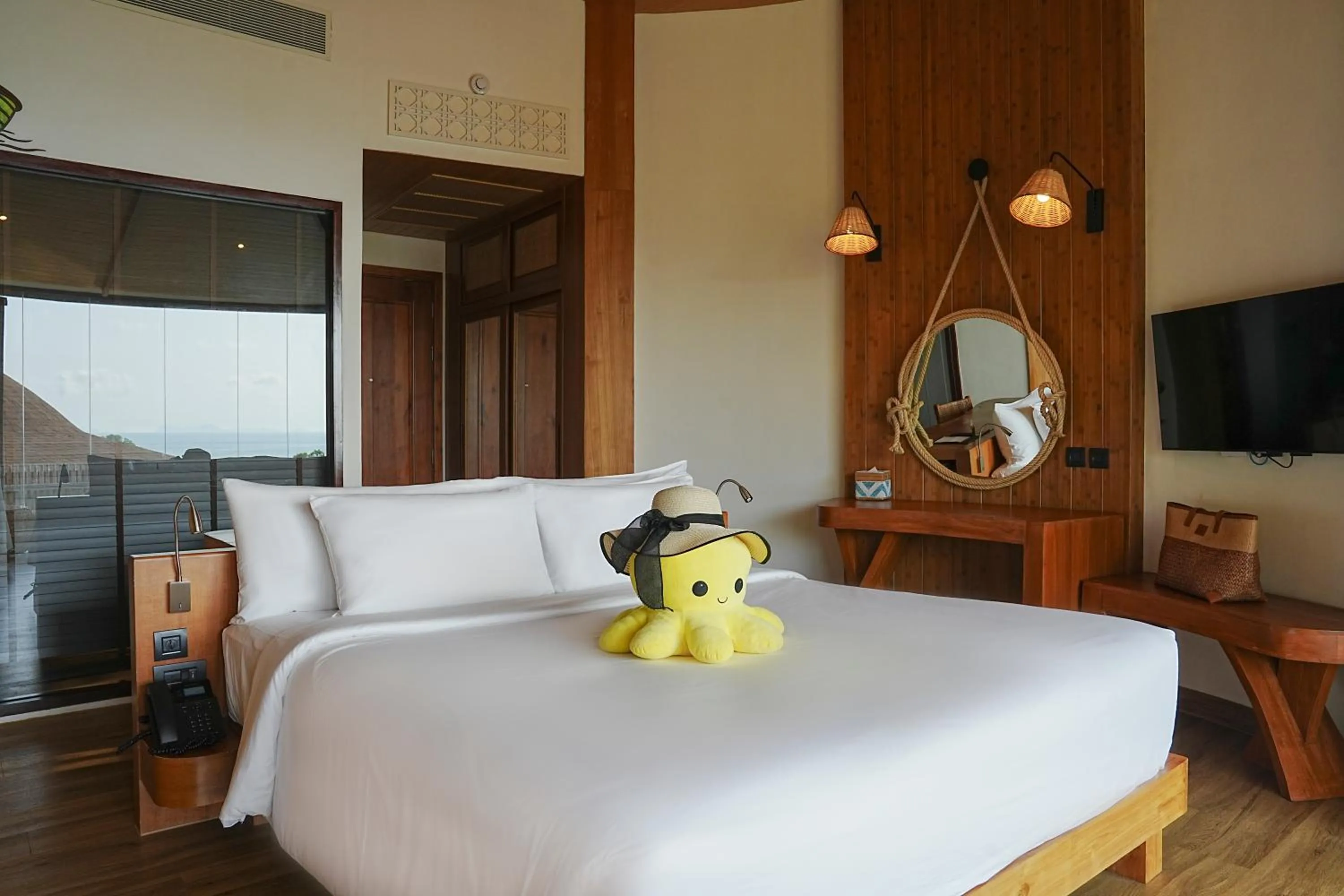 Bed in SINAE Phuket Luxury Hotel