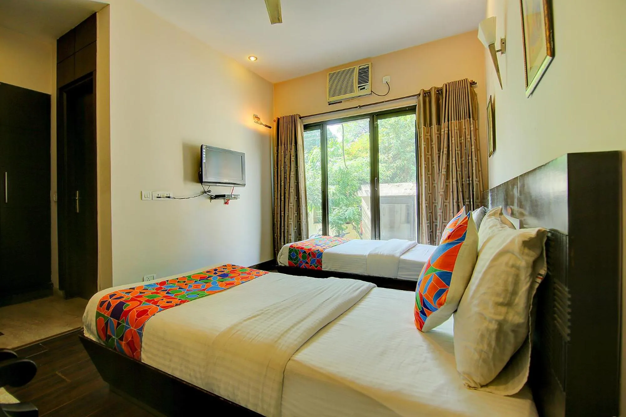 Bed in FabHotel Phoenix Hospitality Near DLF Cyber Hub & Metro, Gurugram