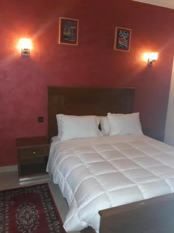 Bed in Amor Hotel