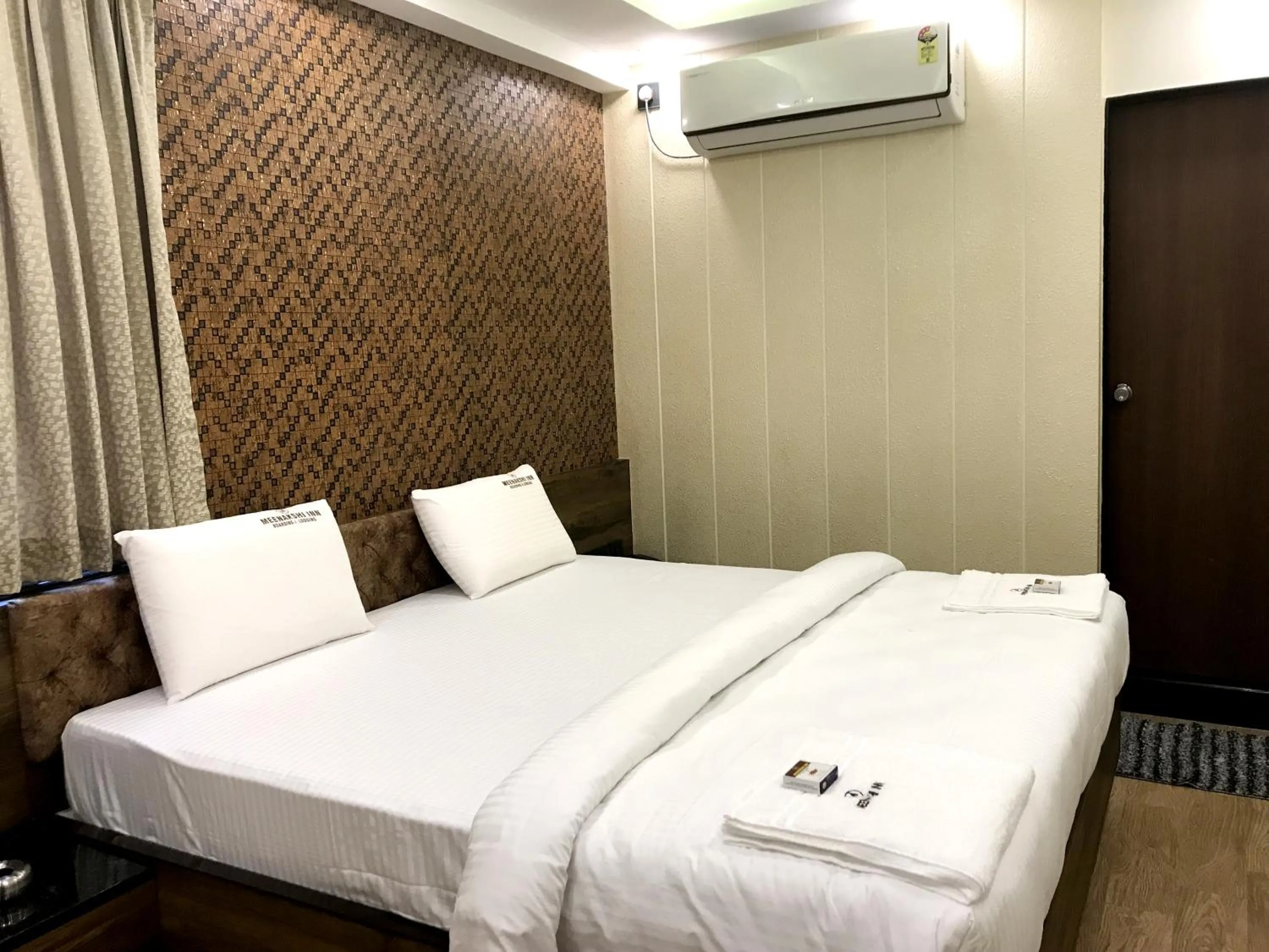 Bed in Meenakshi Inn