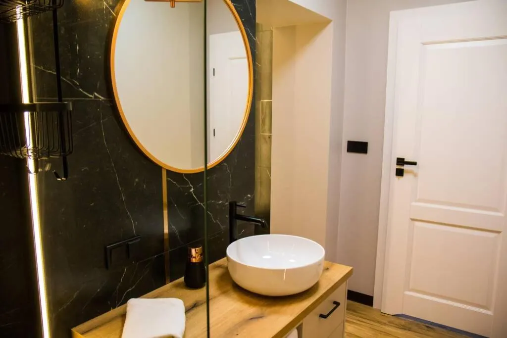 Bathroom in Miedziany by Rentoom