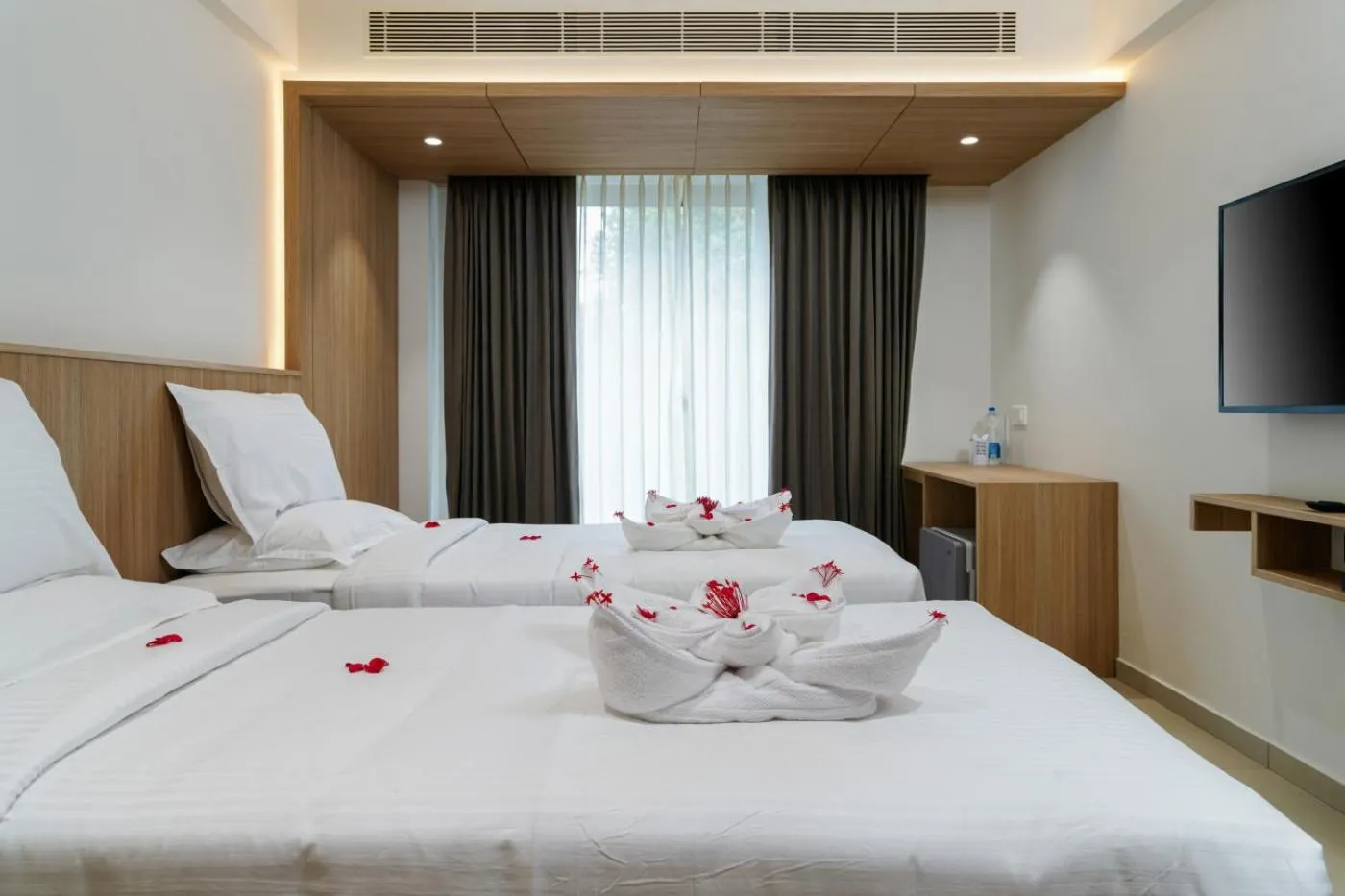 Bed in The Trios Hotel