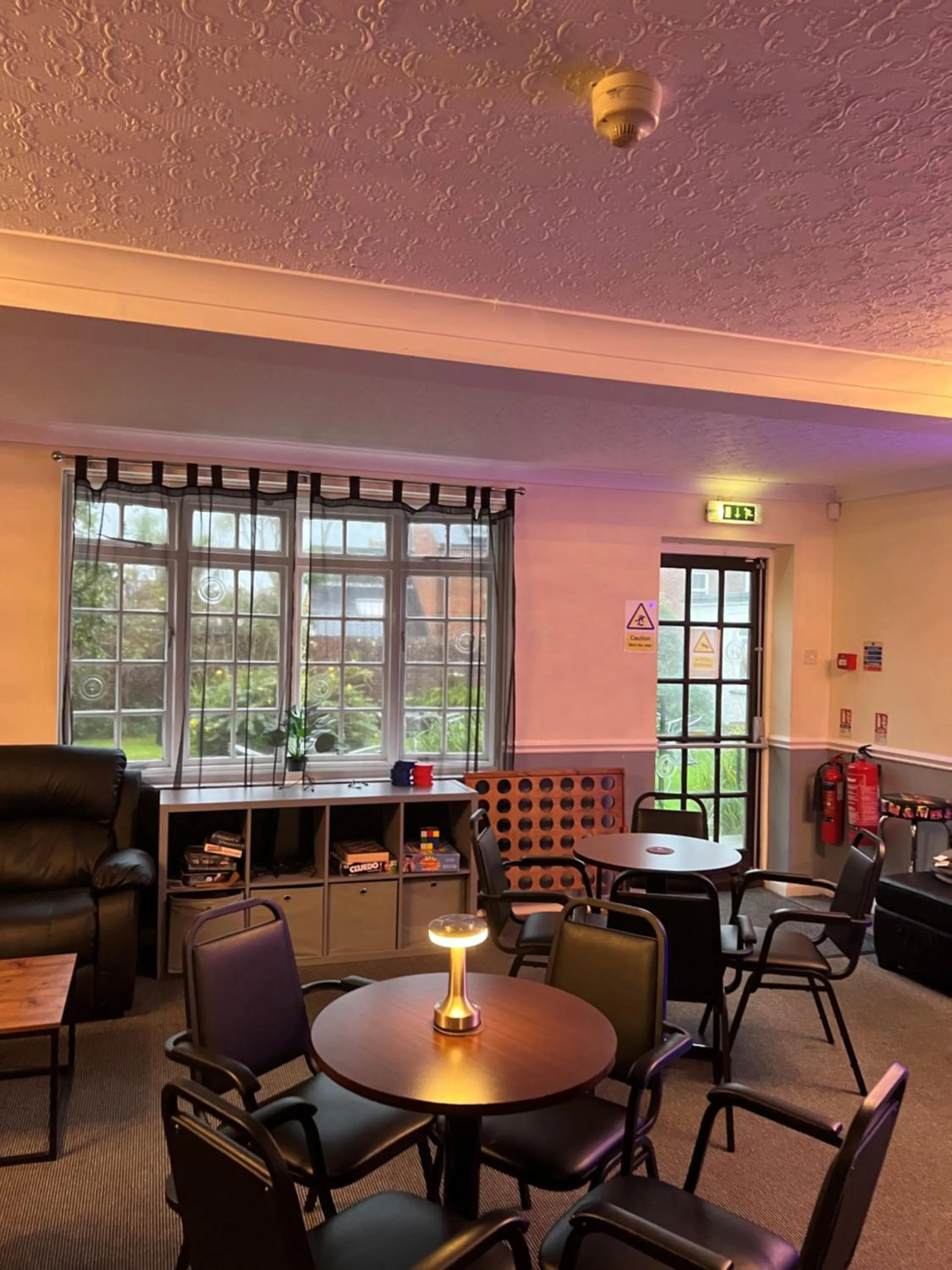 Communal lounge/ TV room in Burlington Hotel