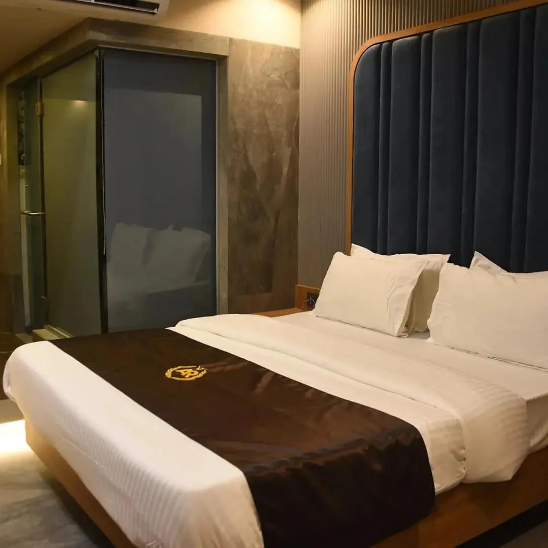 Bed in Hotel AR Residency