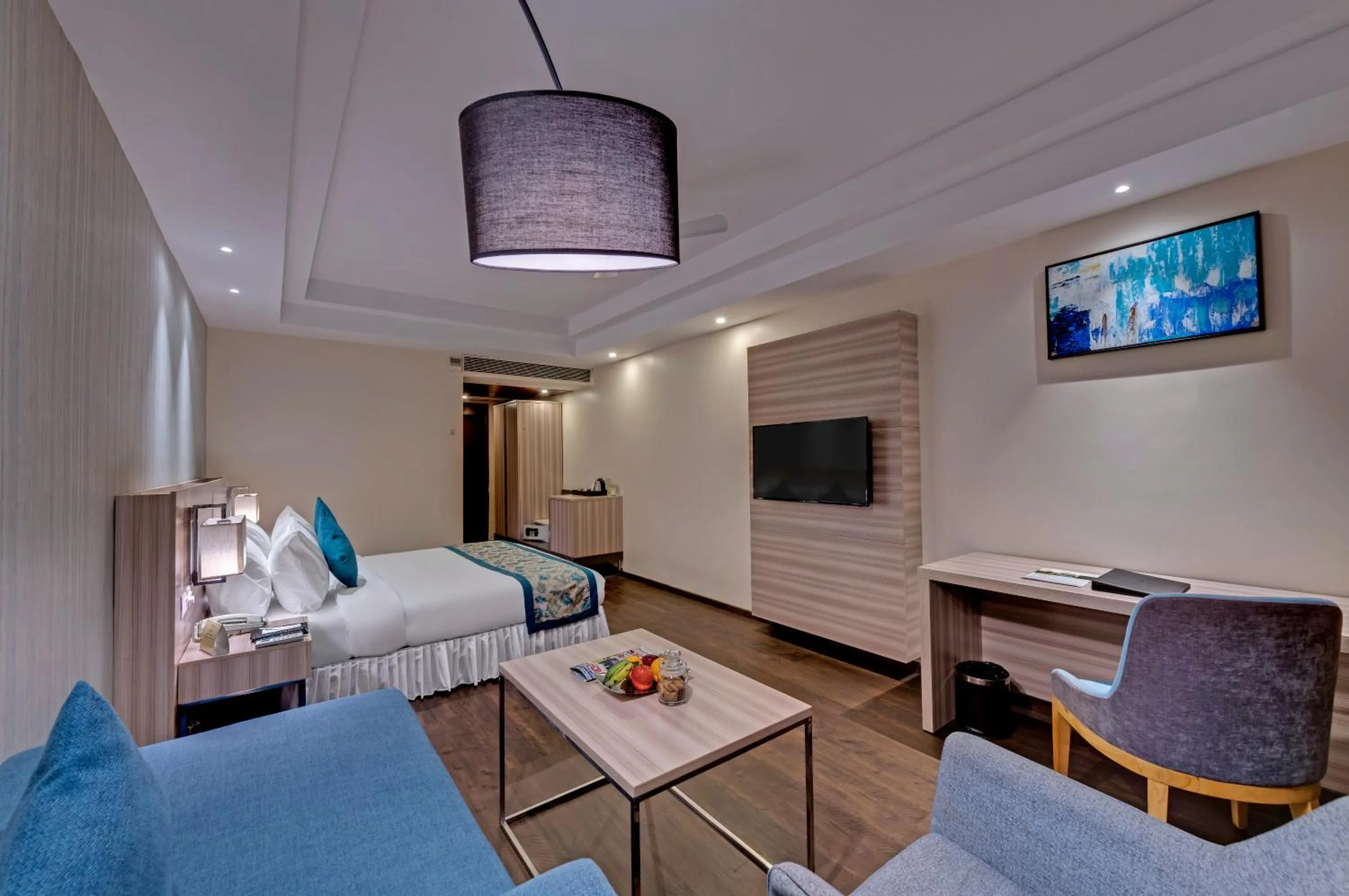 Photo of the whole room, Bed in The Fern Residency Hubballi