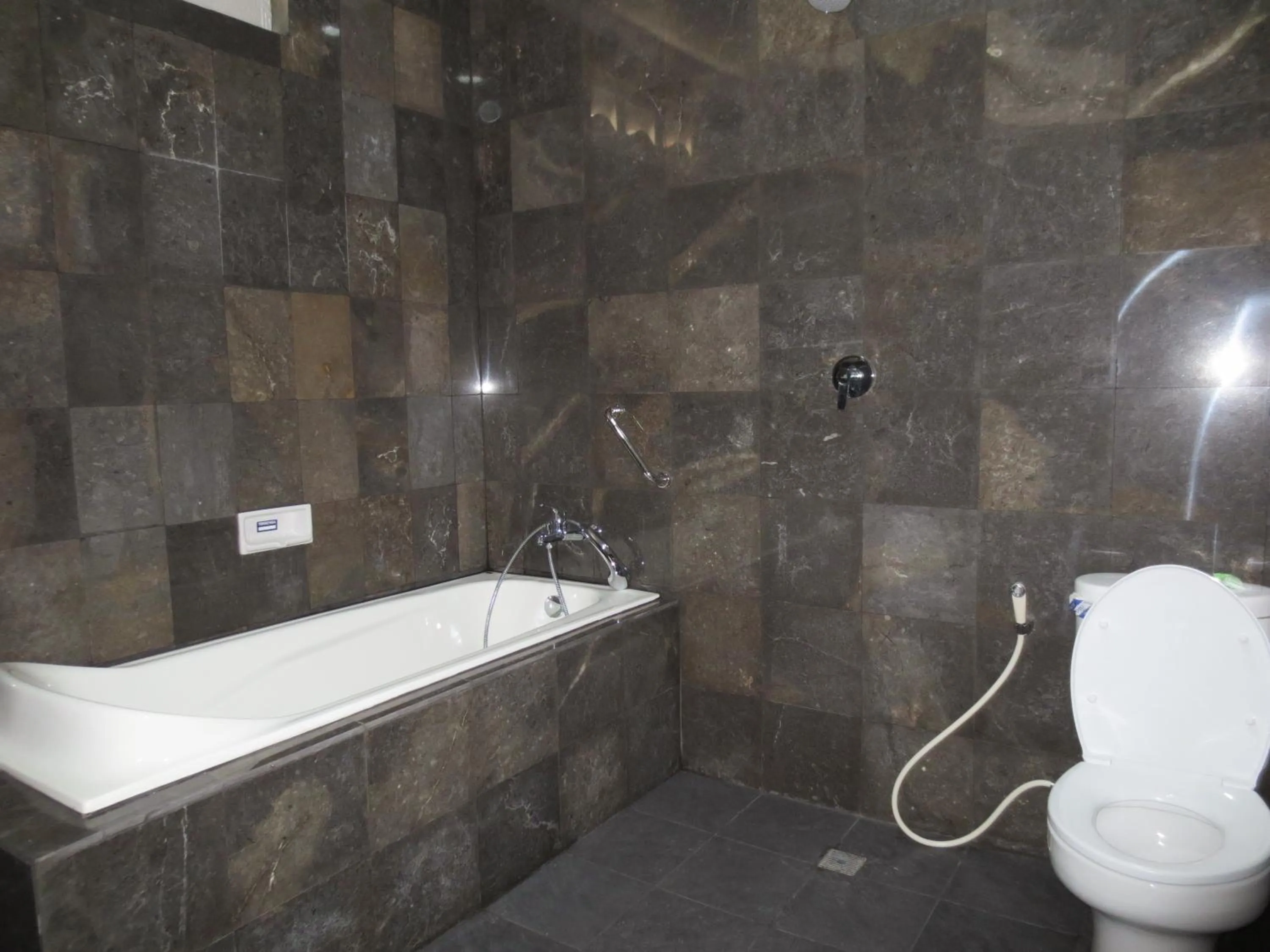 Bathroom in Swastika Guesthouse Sanur