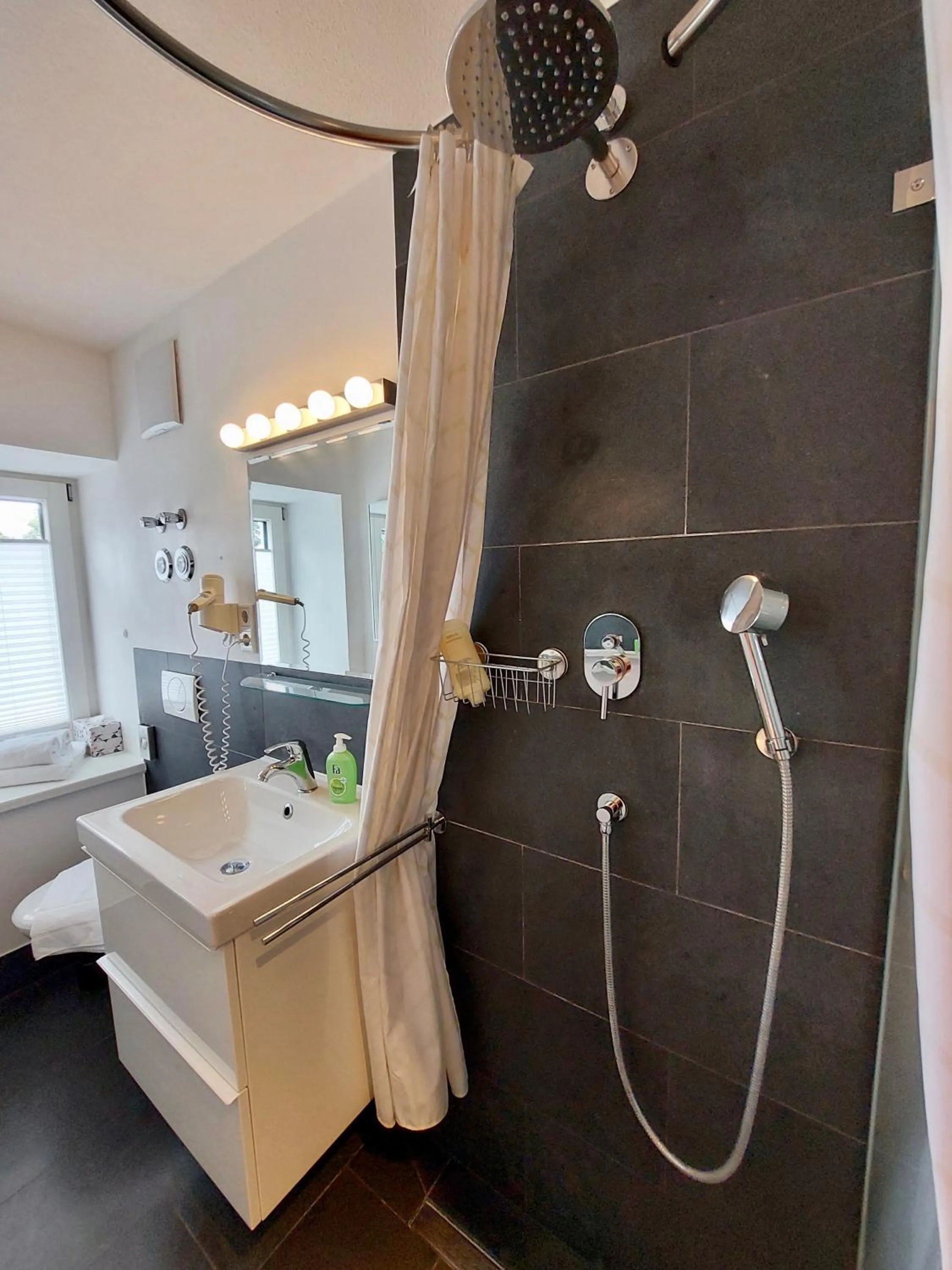Bathroom in Paleo Finest Serviced Apartments