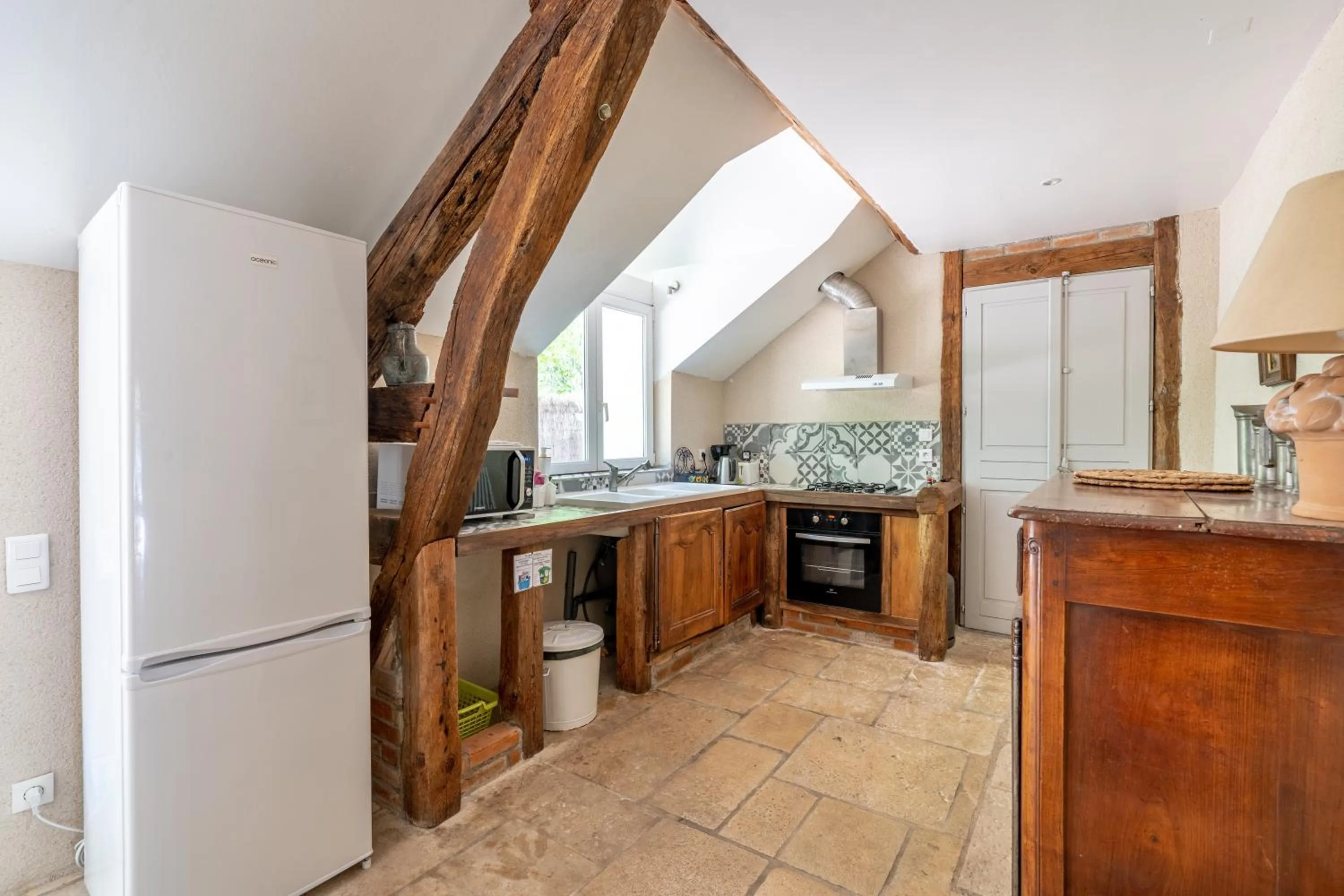 Kitchen or kitchenette in Maison d'hôtes Moulin du Bas Pesé