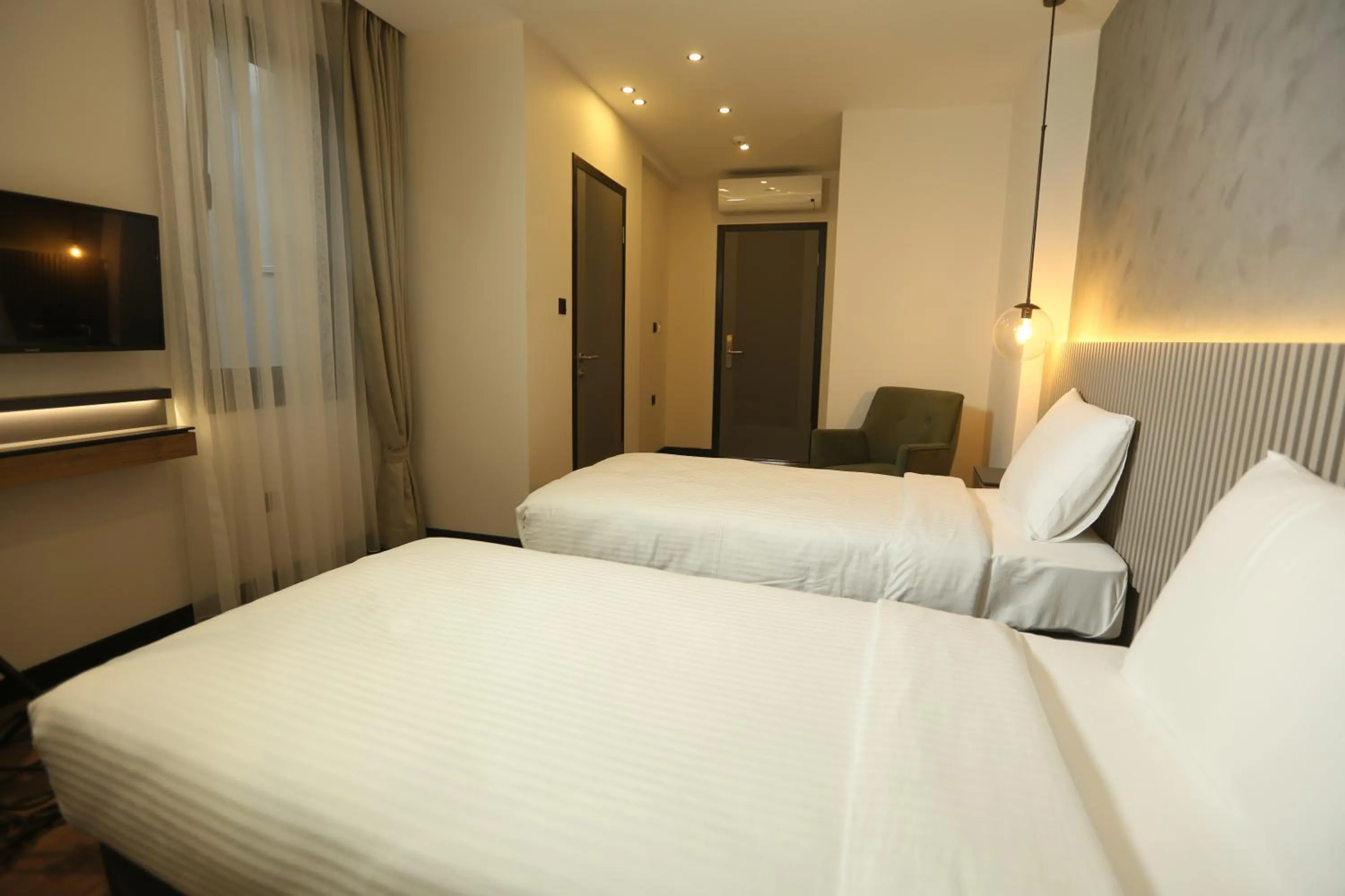 Bed in Moja City Hotel