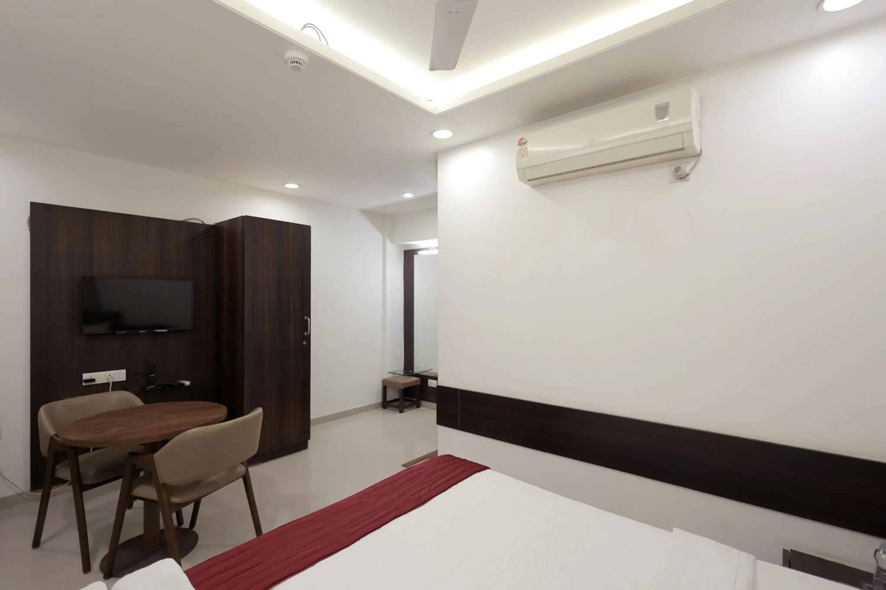 Bedroom, Bed in Hotel Shagun, Piplod City Centre Surat