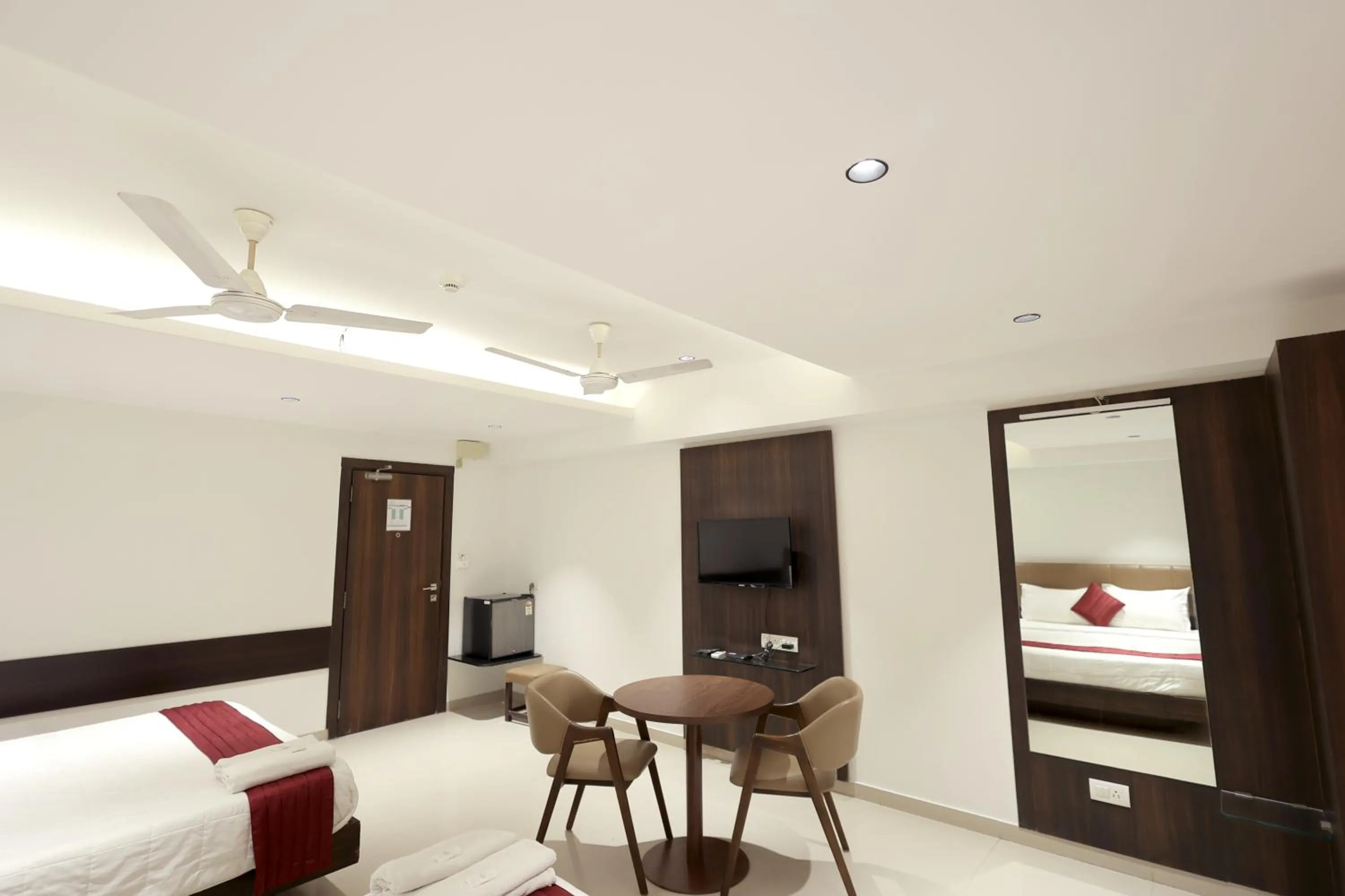 Photo of the whole room, Bed in Hotel Shagun, Piplod City Centre Surat