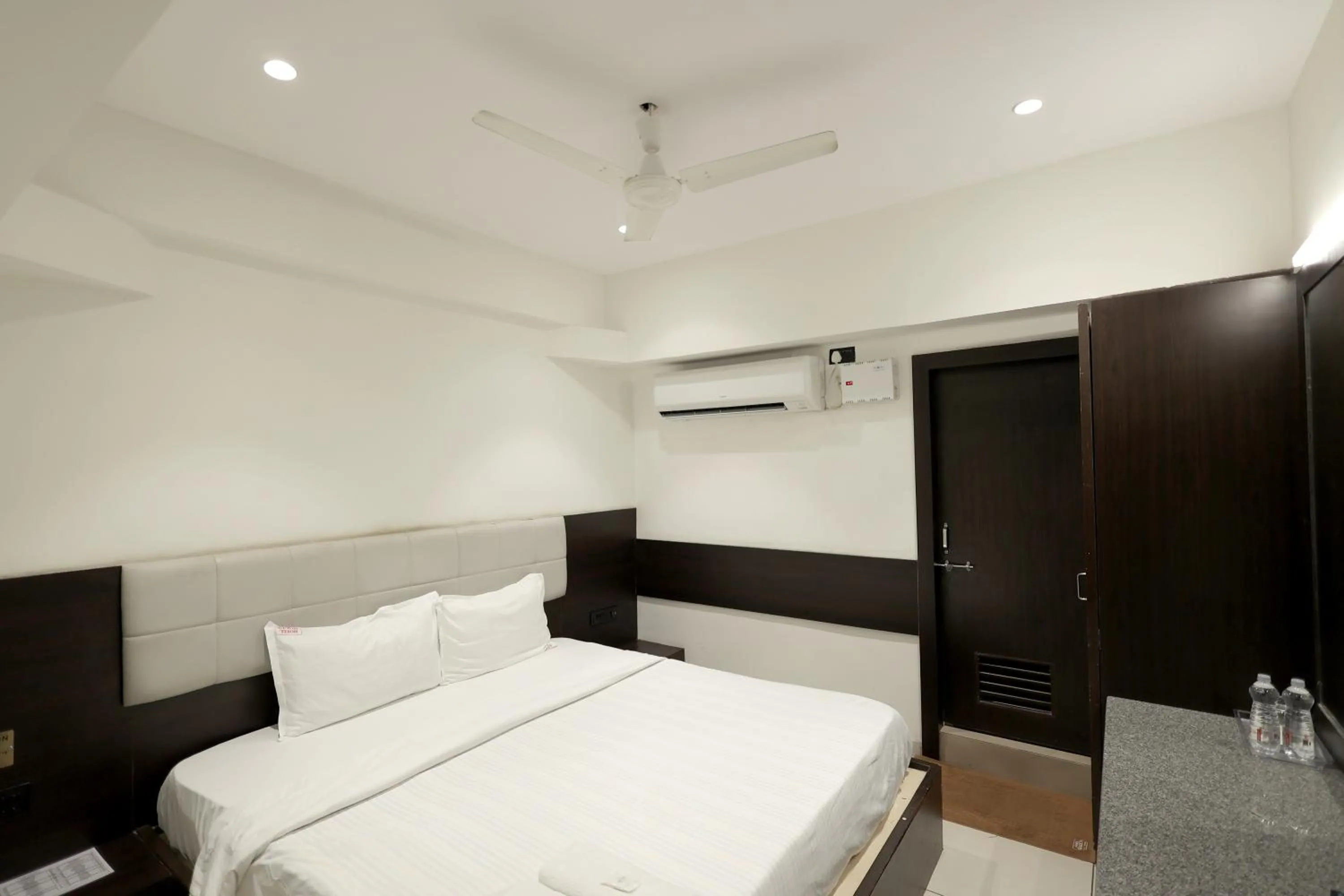 Photo of the whole room, Bed in Hotel Shagun, Piplod City Centre Surat
