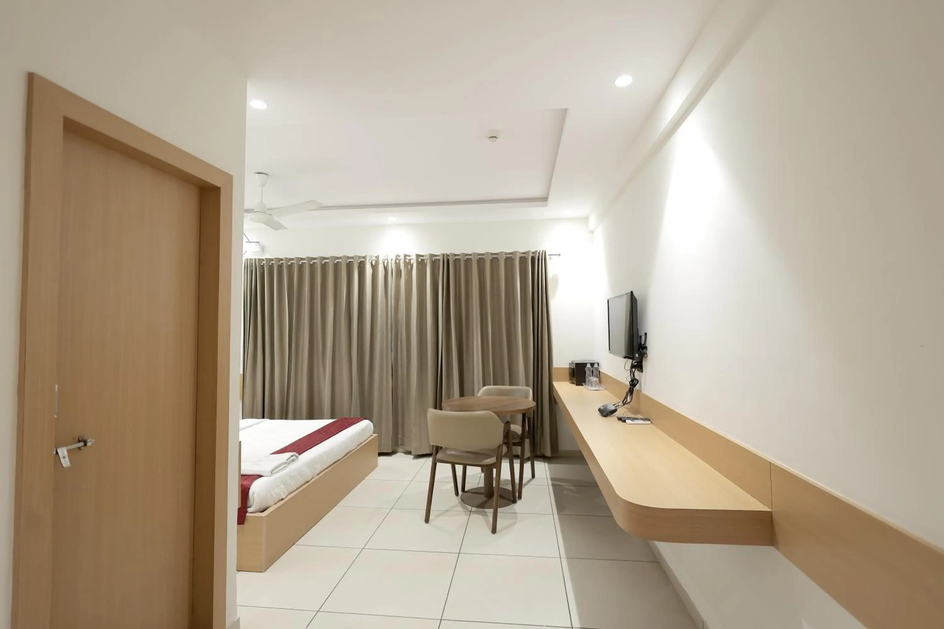 Photo of the whole room, Bed in Hotel Shagun, Piplod City Centre Surat