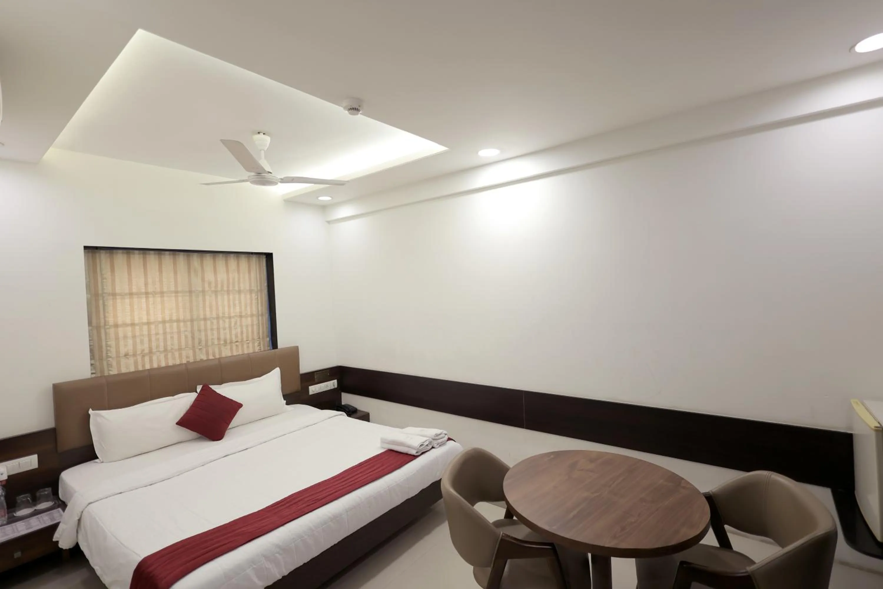 Bedroom, Bed in Hotel Shagun, Piplod City Centre Surat