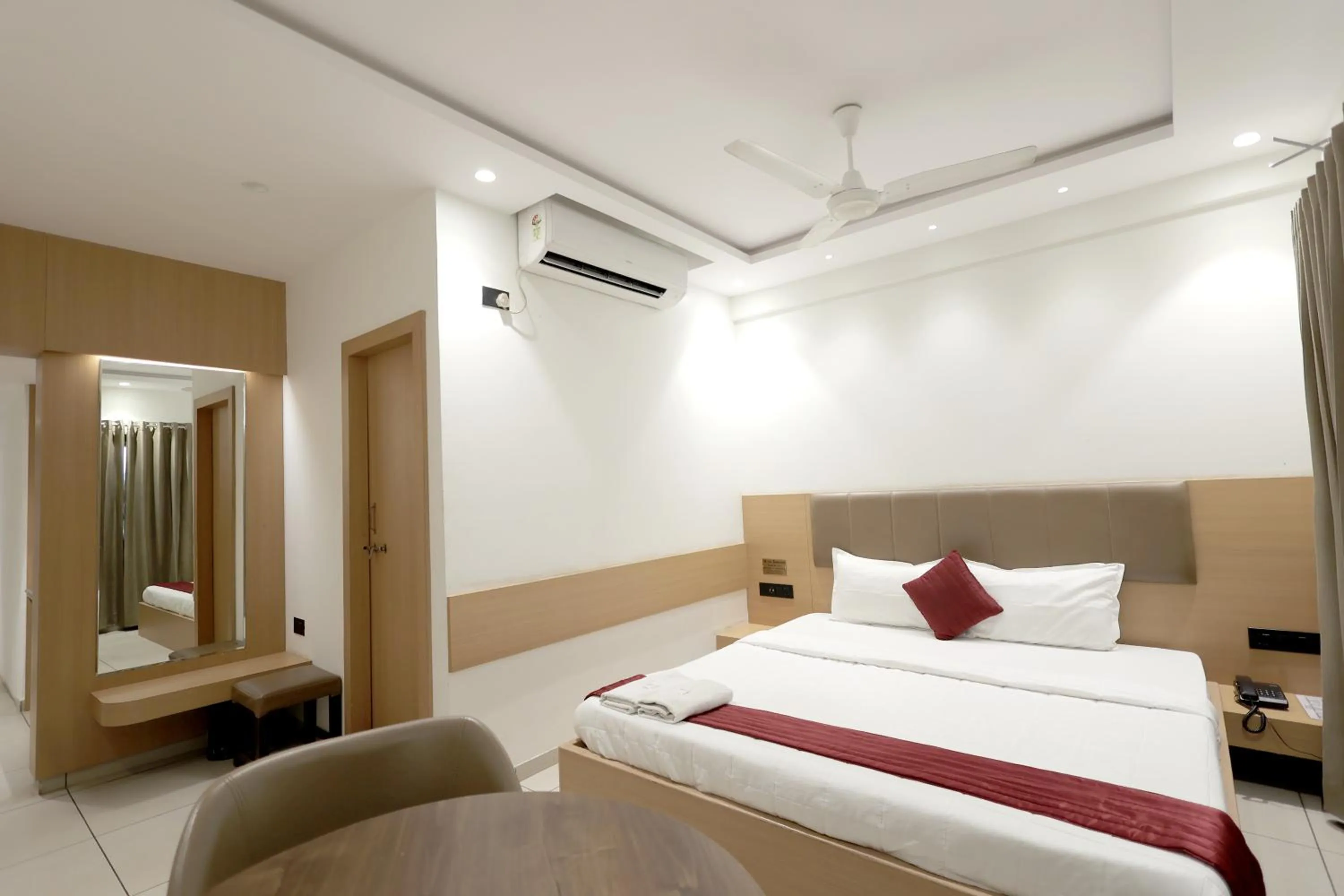 Bedroom, Bed in Hotel Shagun, Piplod City Centre Surat