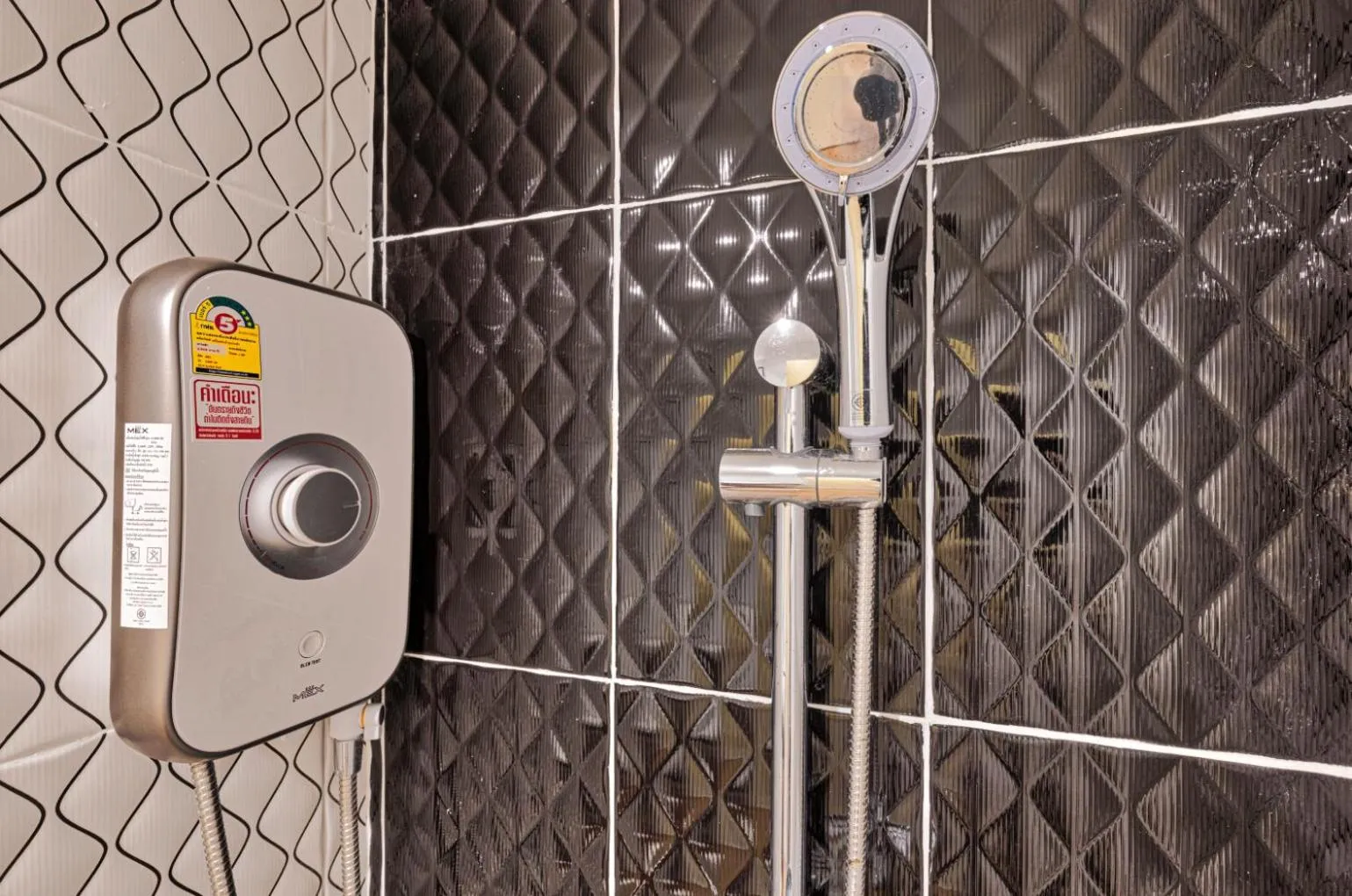 Shower in TJ Patong Hotel - SHA Plus