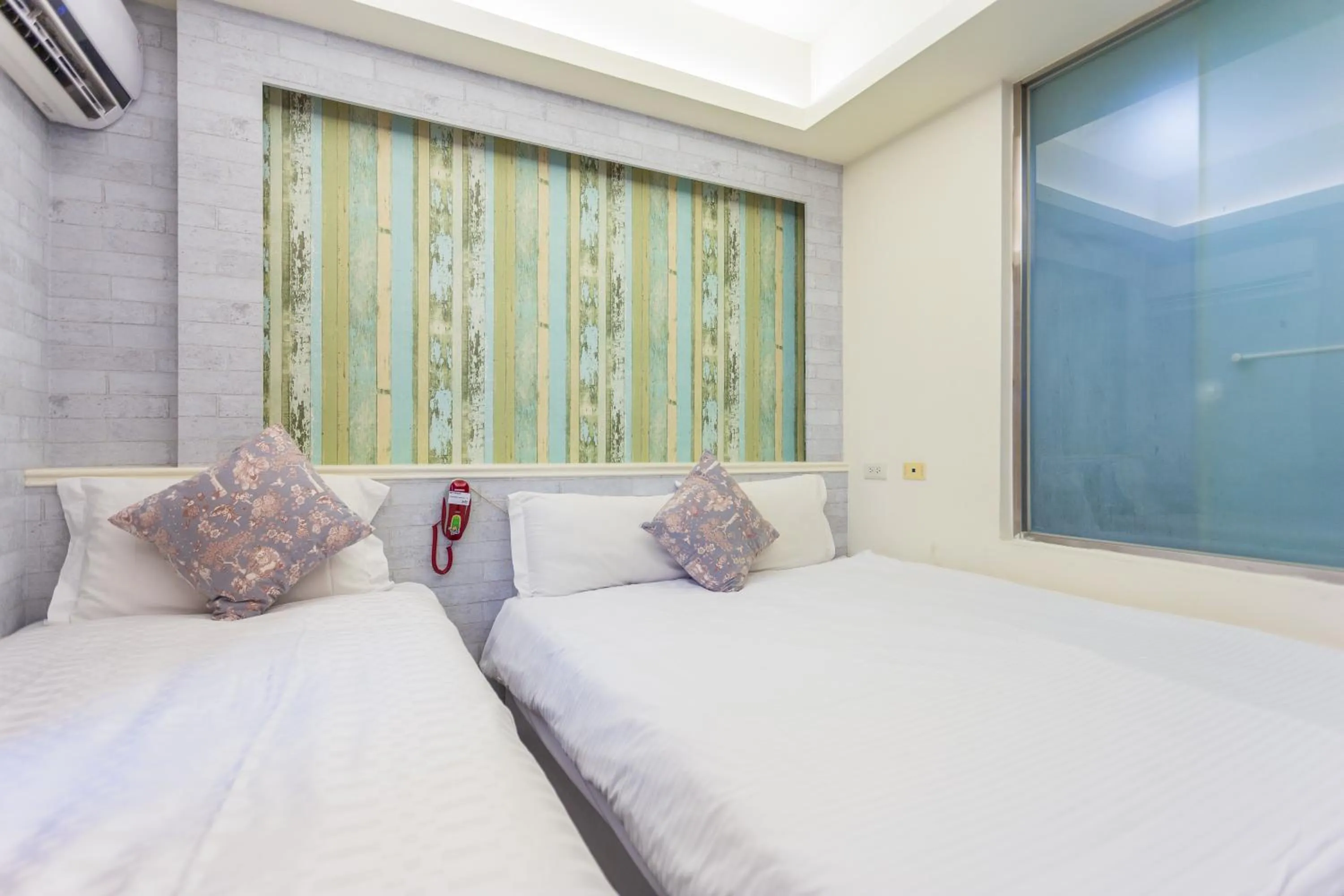 Bed in Newrise Hotel