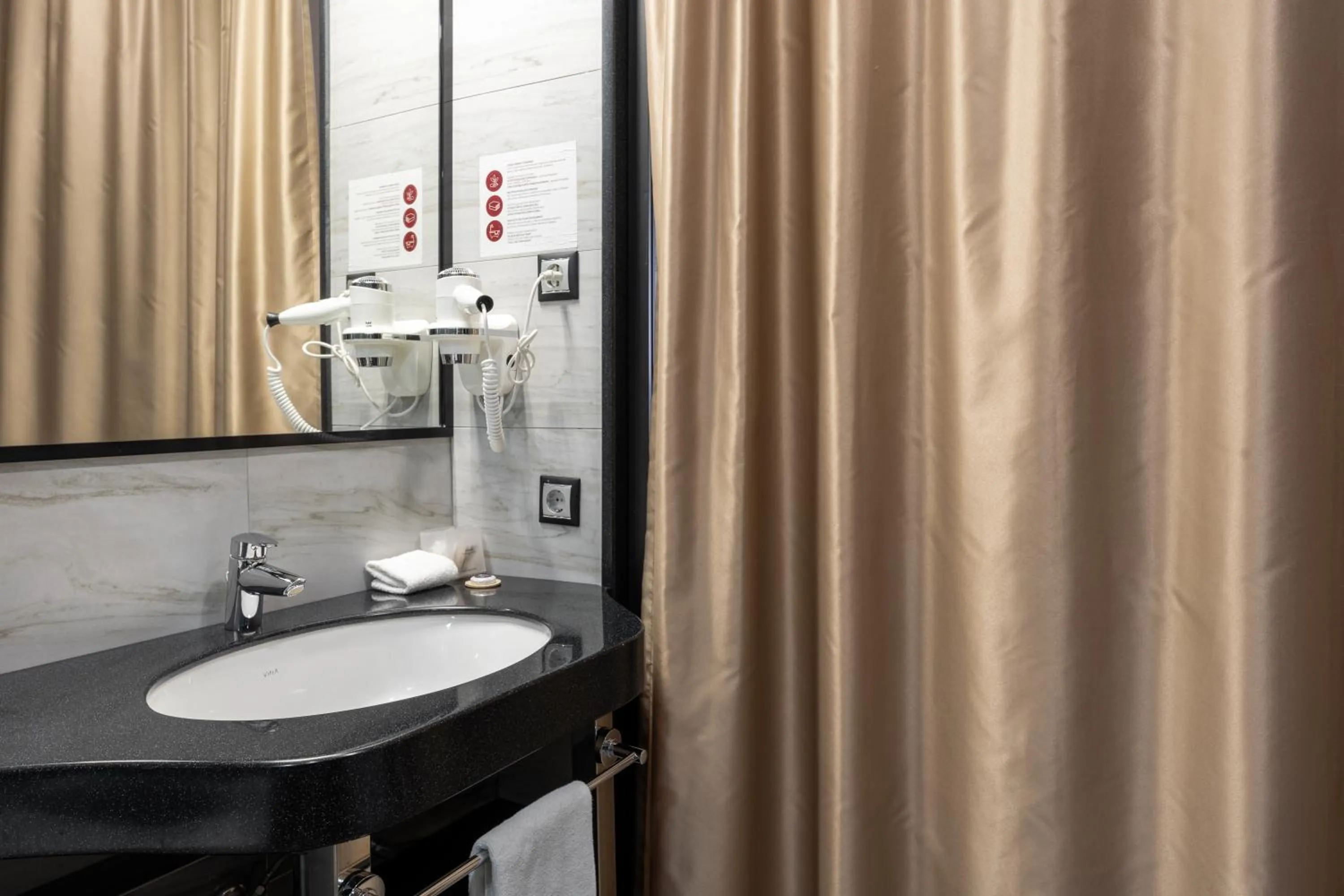 Bathroom in Reikartz Sky Almaty