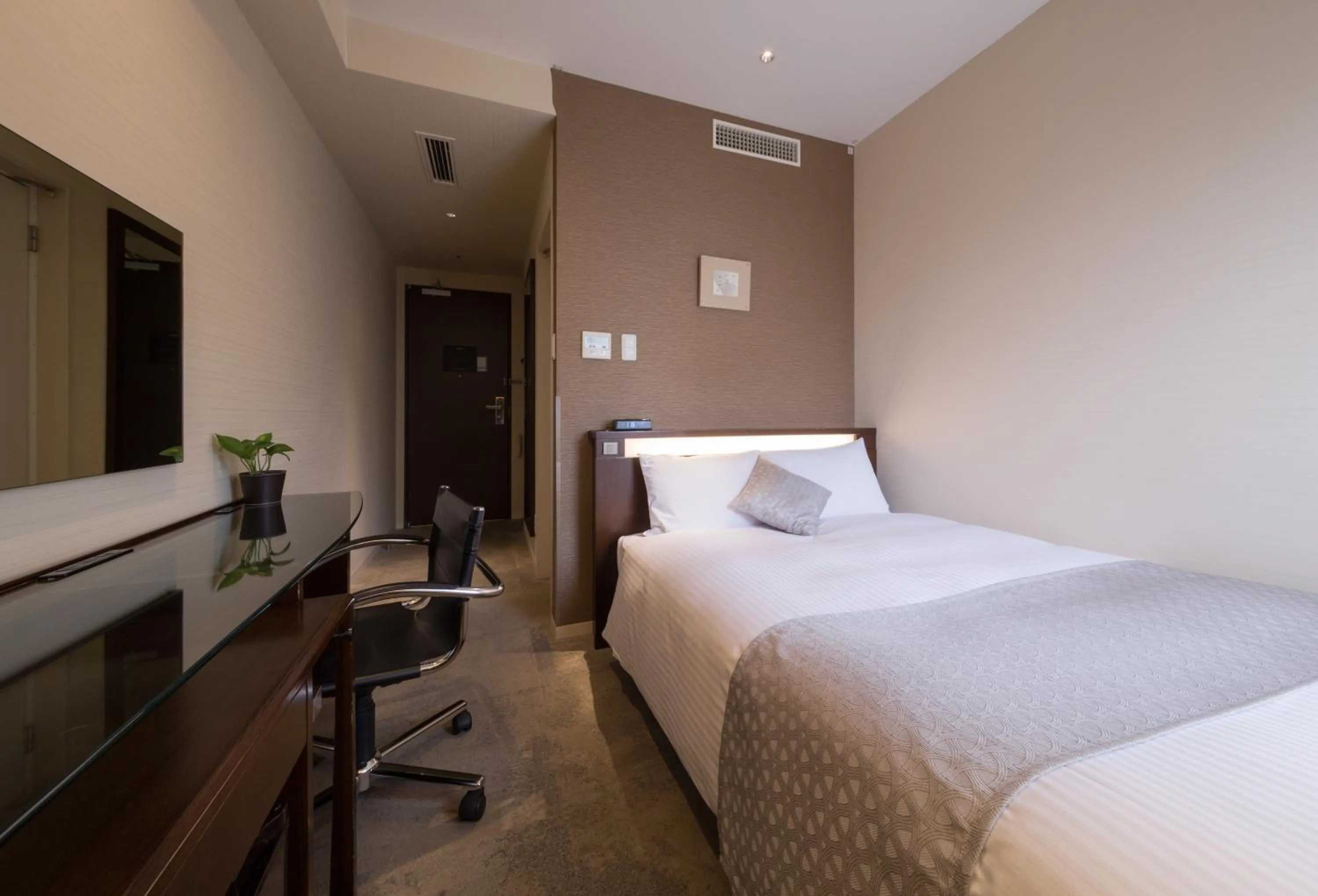 Bed in Hotel Tenjin Place