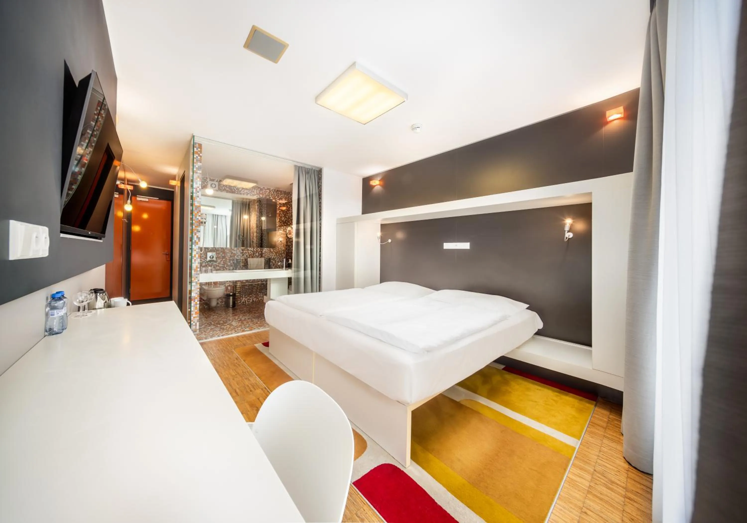 Bed in Omnia Hotel Relax & Wellness