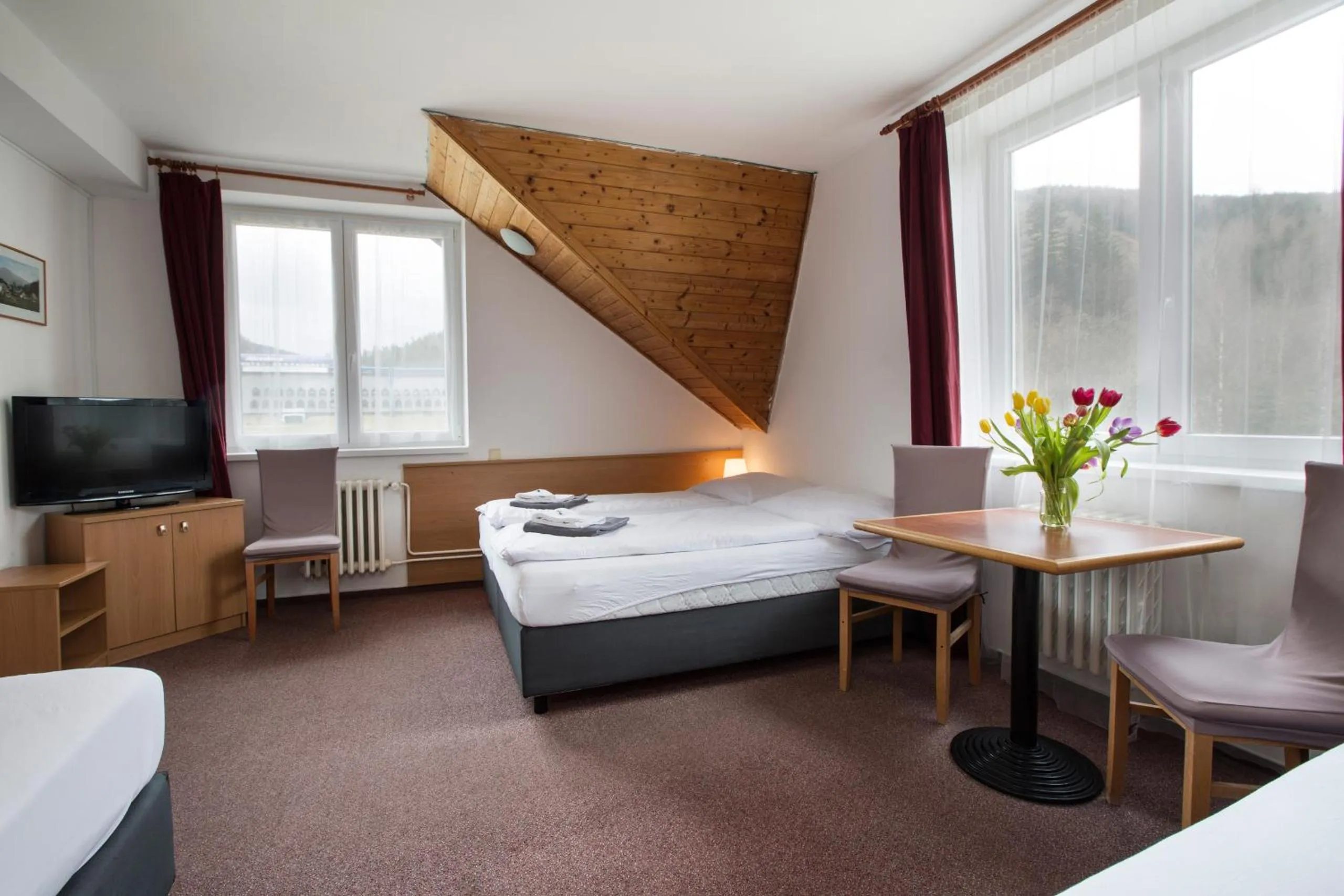 Bed in Hotel Harrachov Inn