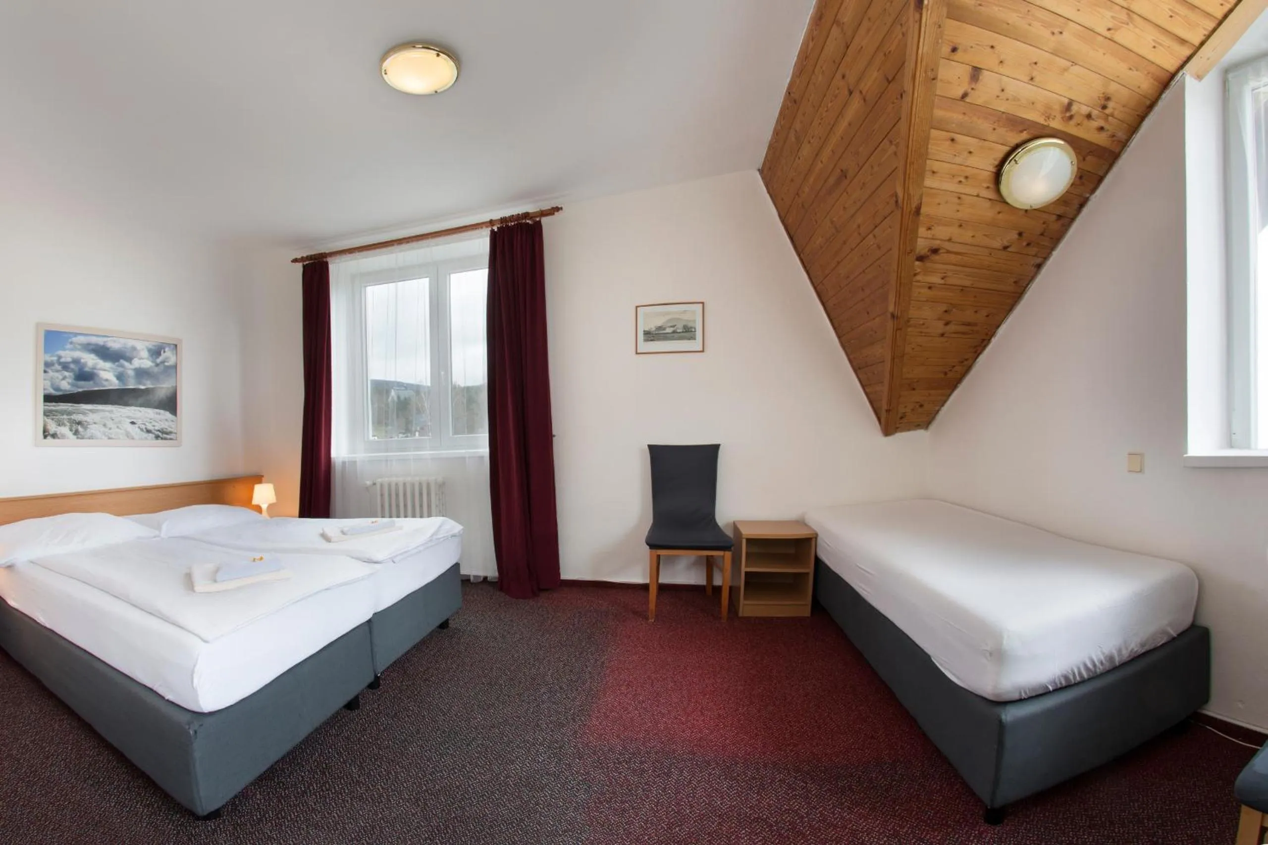 Bed in Hotel Harrachov Inn