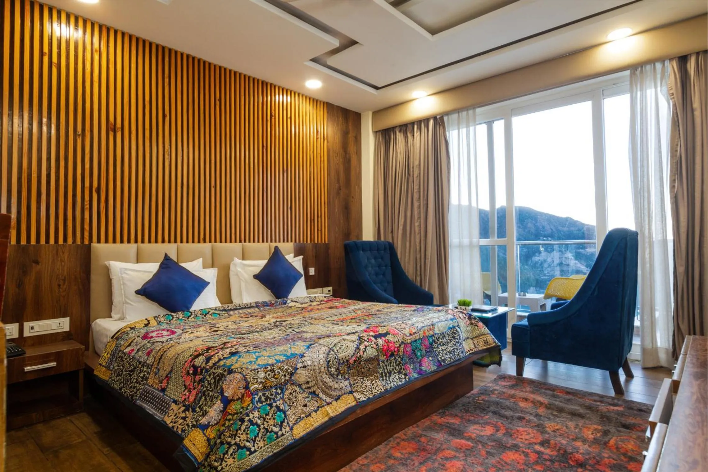 Bed in Tripli Hotels Shivaay