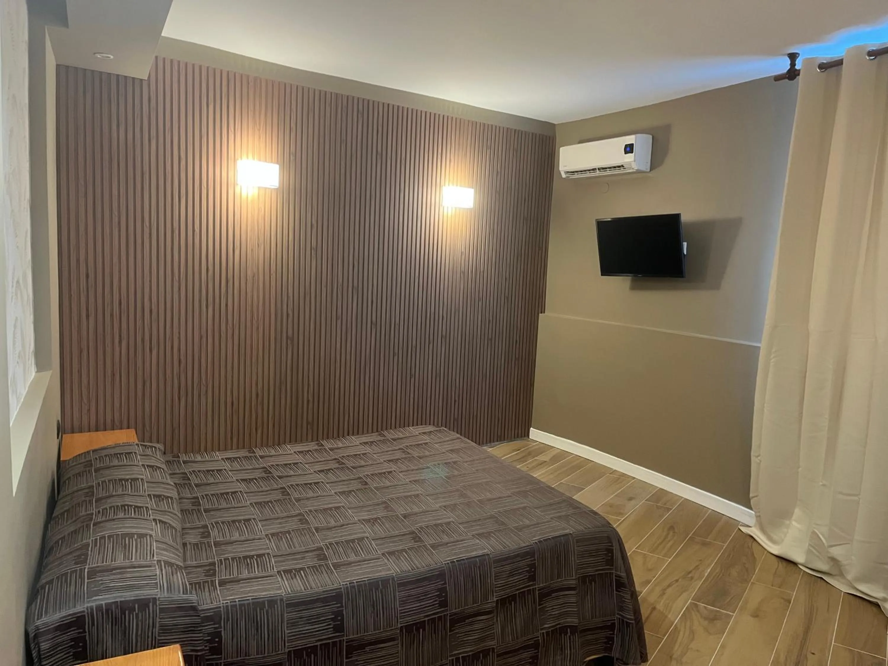 Bed in Hotel Ginepro