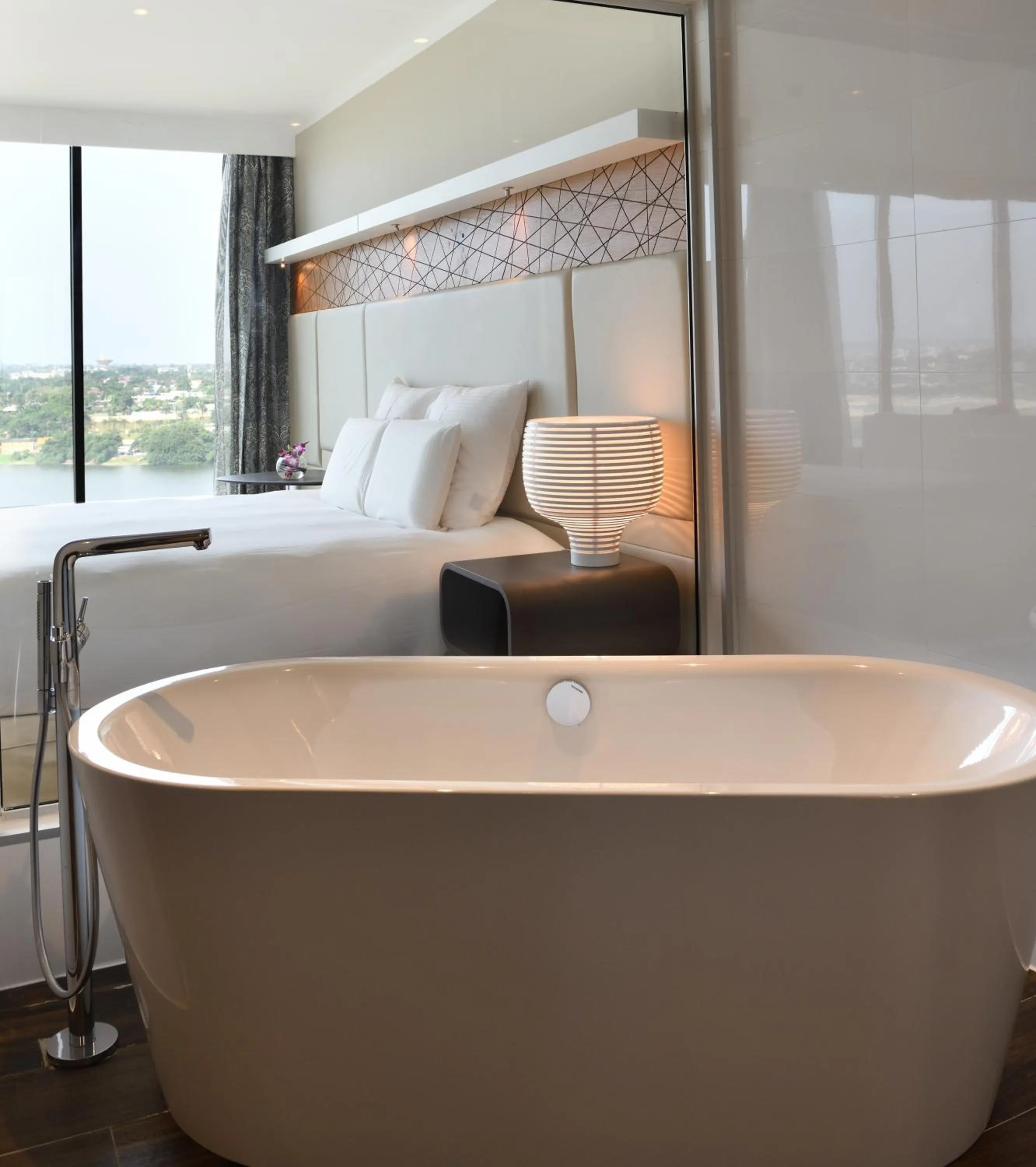 Bathroom, Bed in Pullman Abidjan