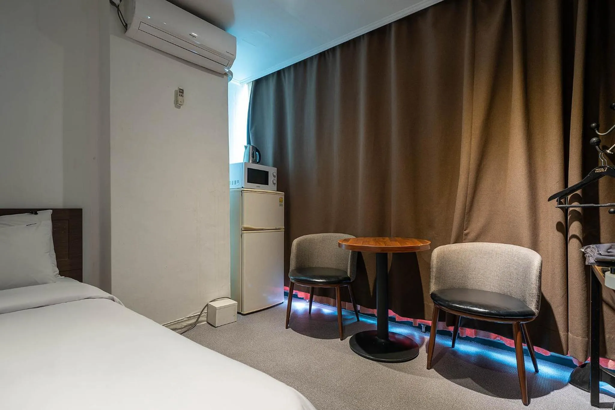 Bed in Pacific7 Hotel